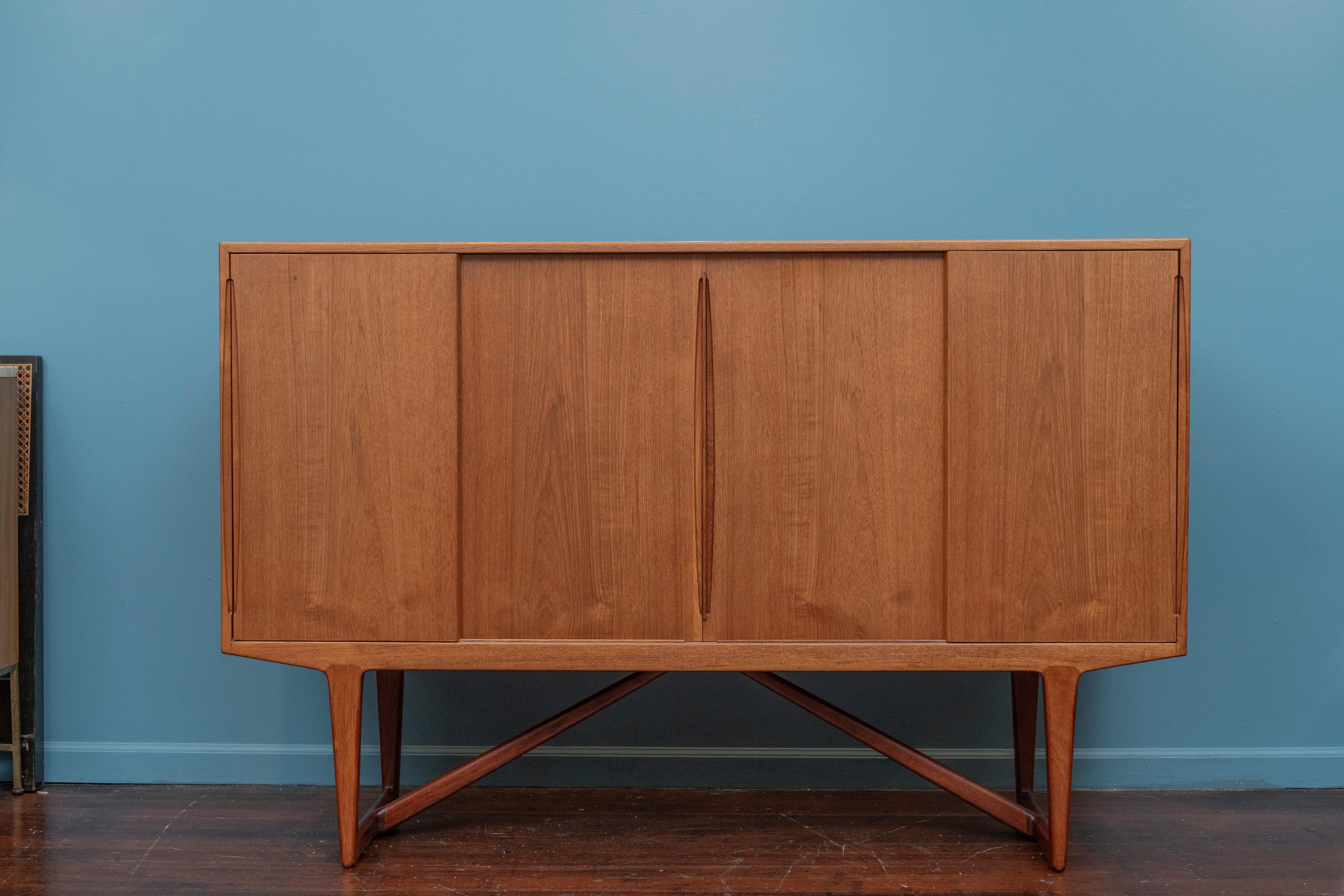 Kurt Ostervig design teak credenza for Brande Mobelindustri, Denmark. High quality construction and materials in a multi purpose credenza. Perfect anchor piece for a dining room or to use for storage. Fitted interior comprises five adjustable
