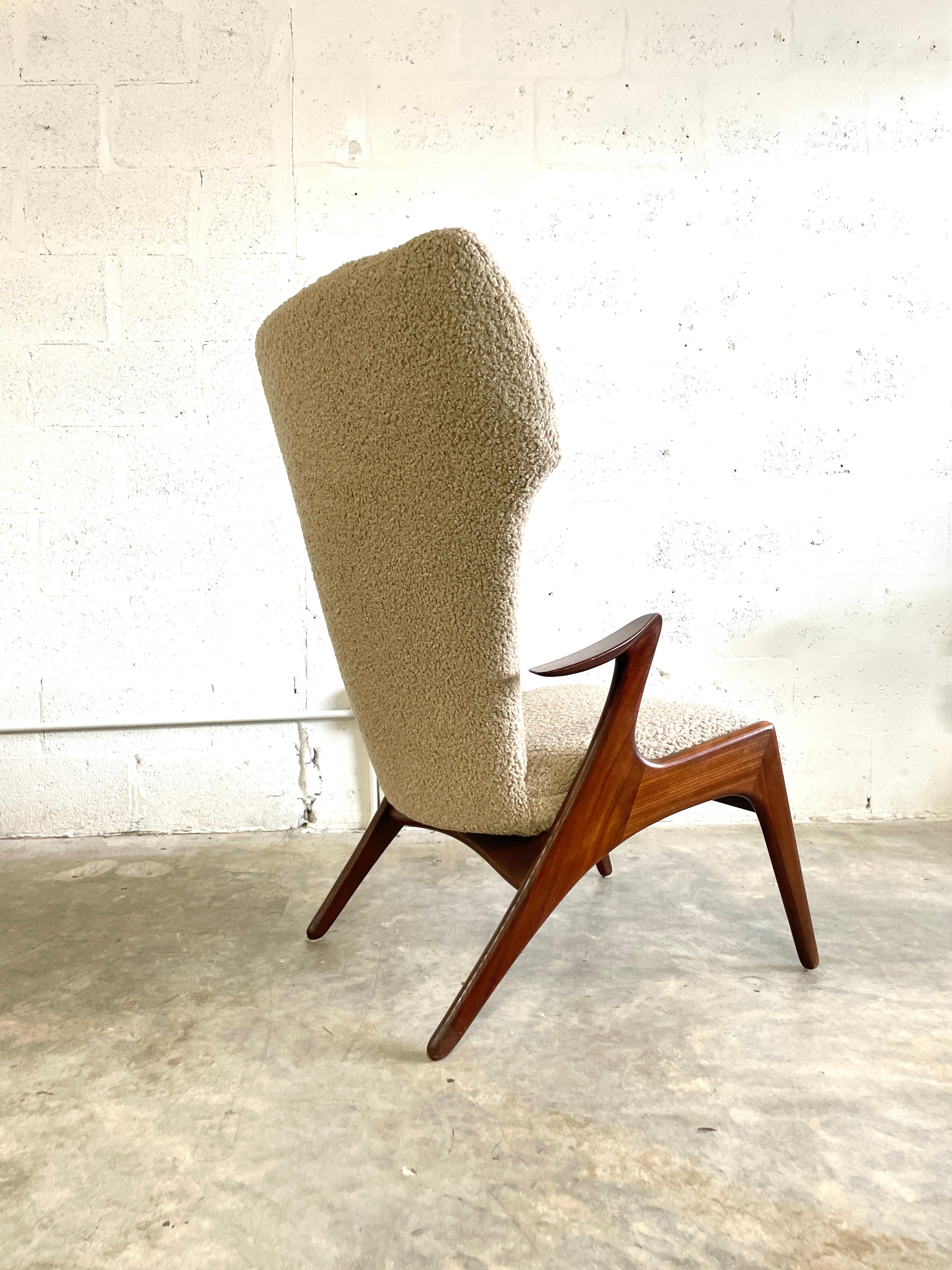 Stunning and rare Kurt Ostervig Wingback Chair for Rolschau Mobler. Recently upholstered. Solid walnut frame.