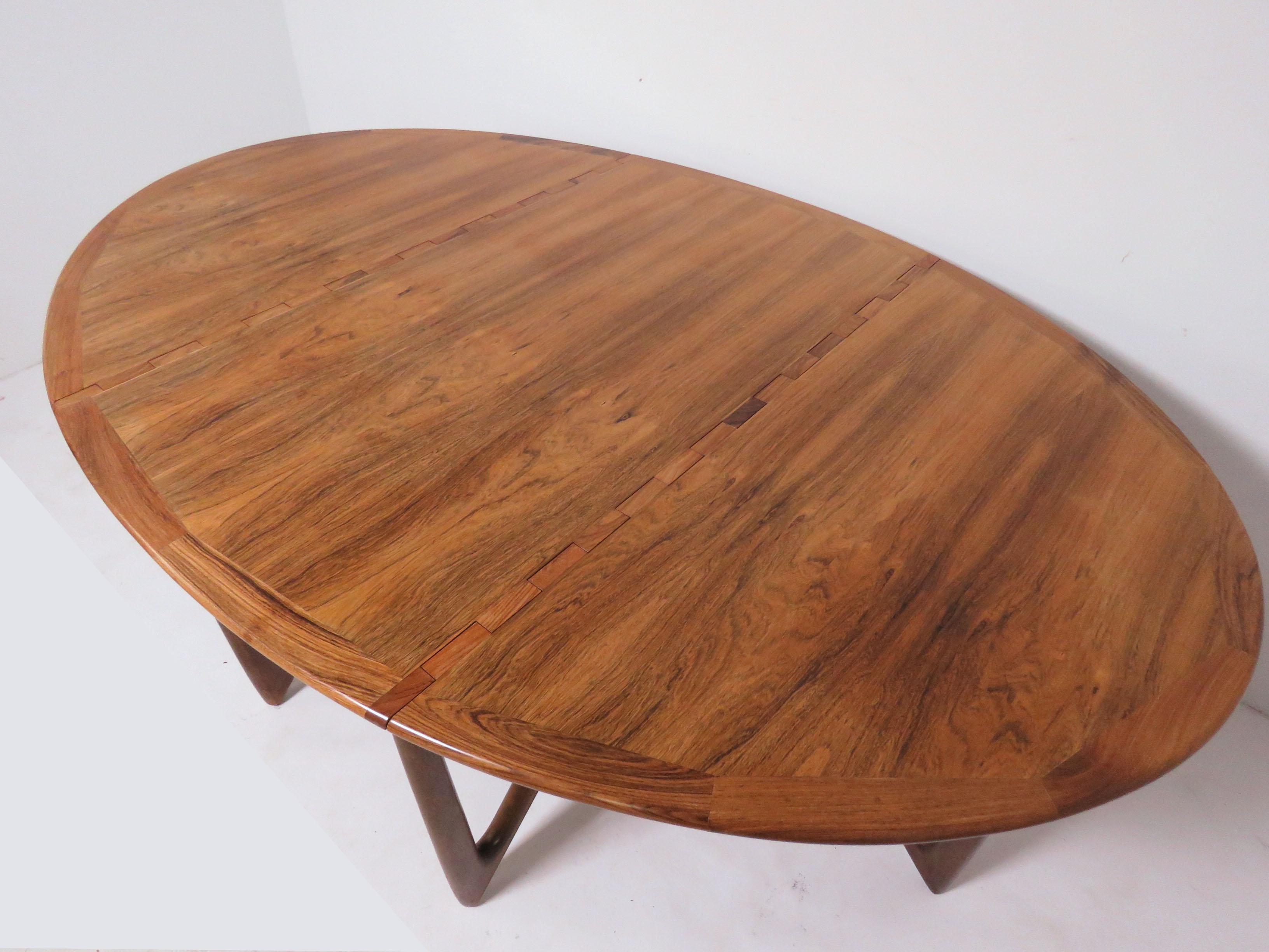 Rosewood drop-leaf gate leg dining table with sculptural 