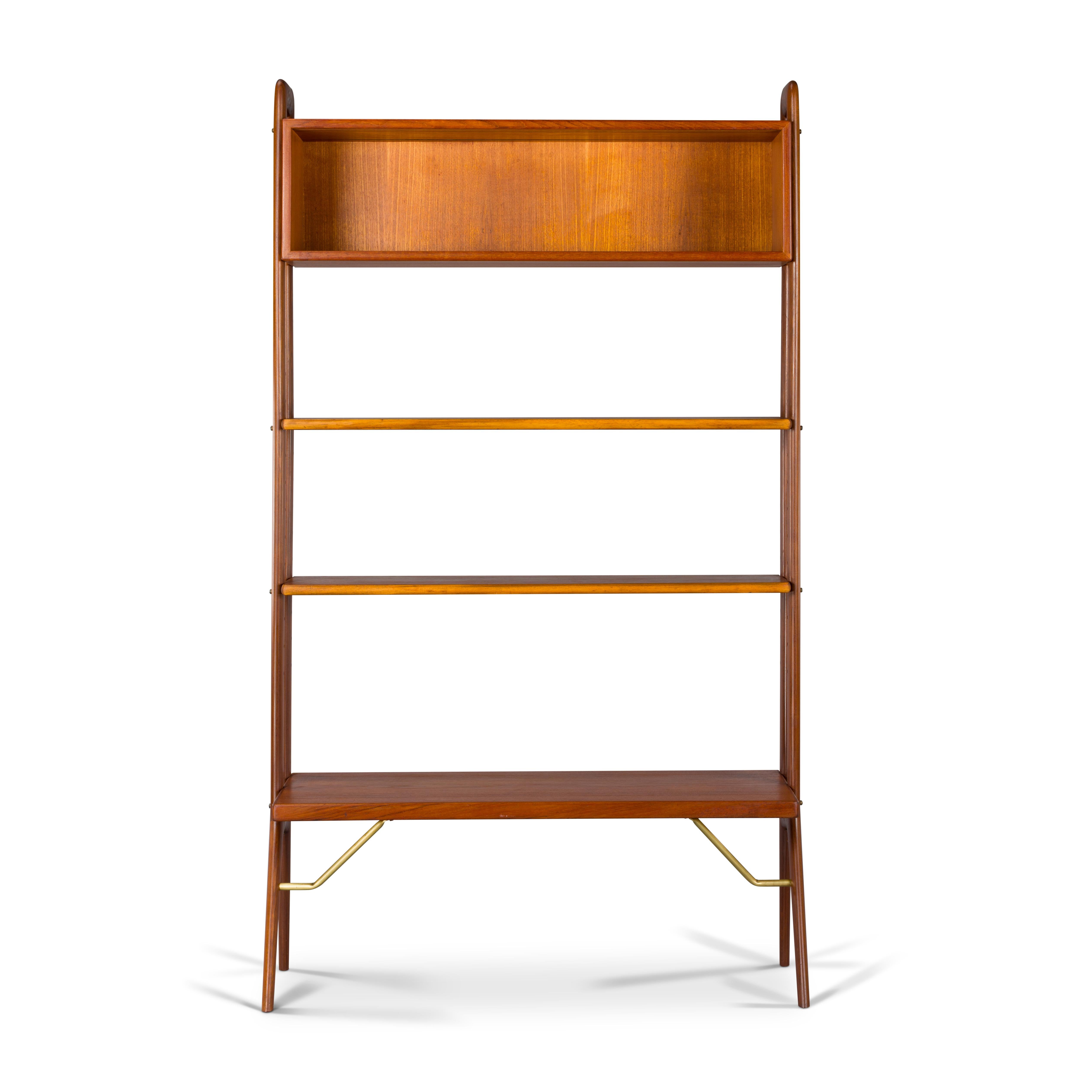 This Danish Mid-Century Modern freestanding room divider or bookshelf is a top -quality unit. Design by Kurt Ostervig. This chest features two height adjustable shelves, one big shelf supported by brass rods. The upper cabinet can be featured by