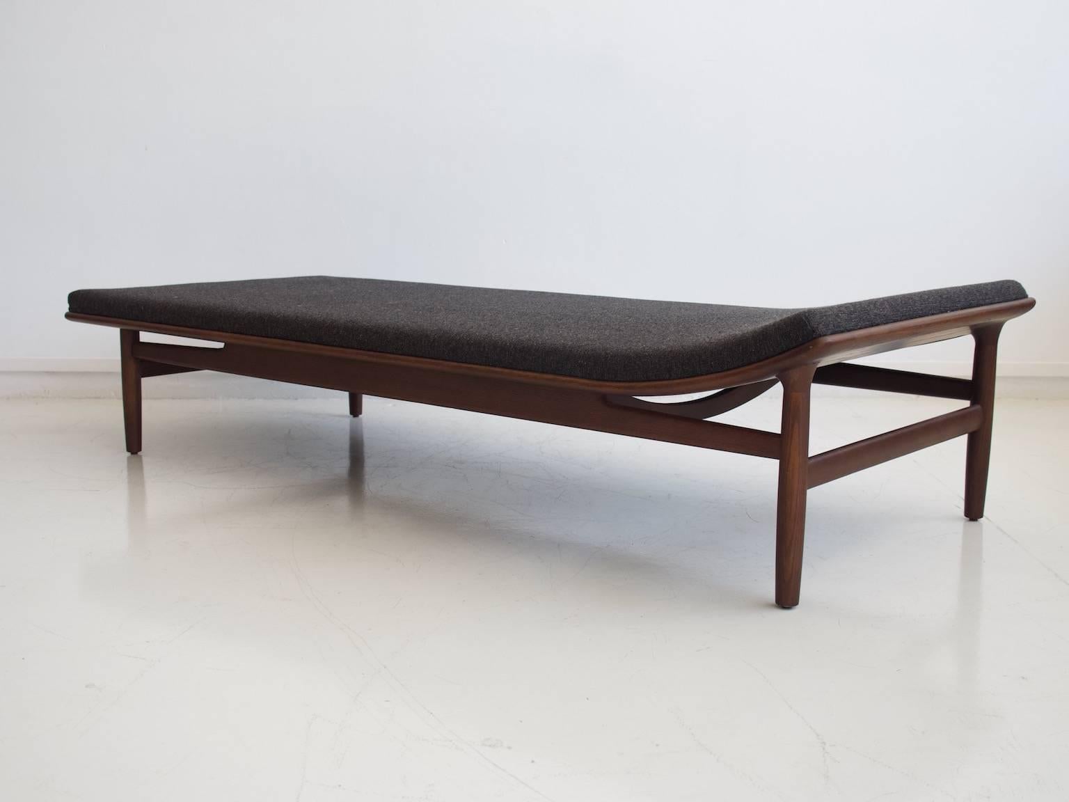 Kurt Ostervig (1912-1986) designed this daybed, model 311, in circa 1958. Frame made of walnut-stained American oak. Cushions upholstered in wool from Kvadrat. Height of the frame 36 cm, with cushion 42 cm. Reproduced by Matzform under license.