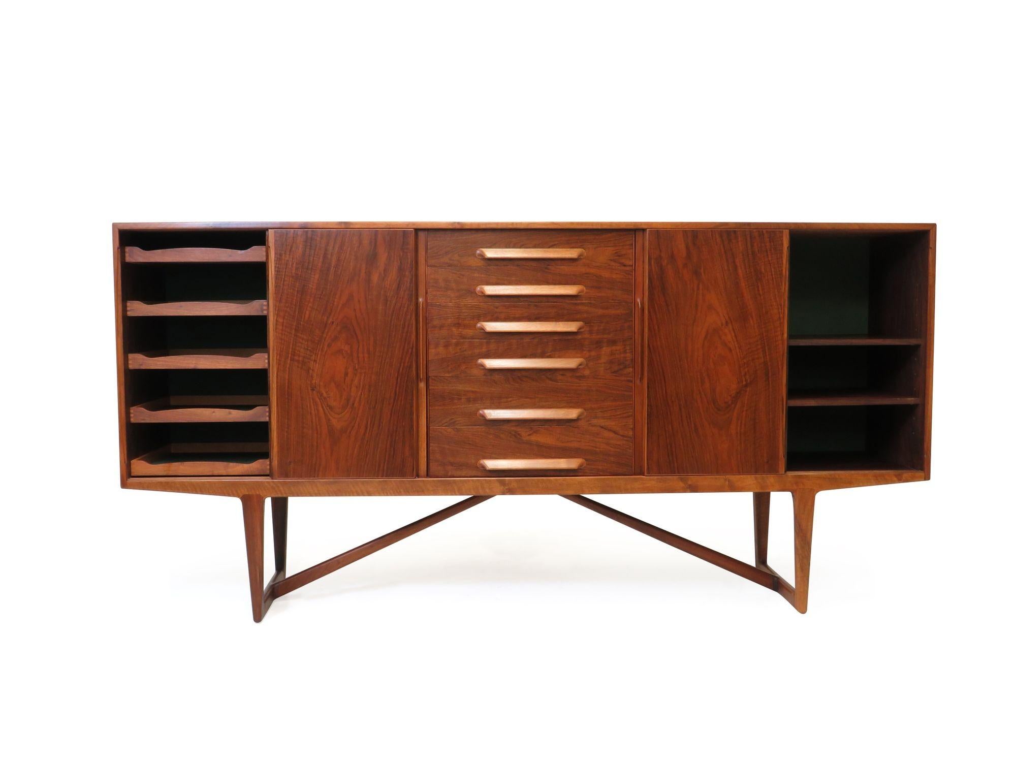 Sideboard designed by Kurt Ostervig for Brande Møbelfabrik, 1956, Denmark. Features a stunning burled walnut exterior with pattern match on the doors, finely mitered corners, and series of drawers in center, each with sculpted inset pulls. The
