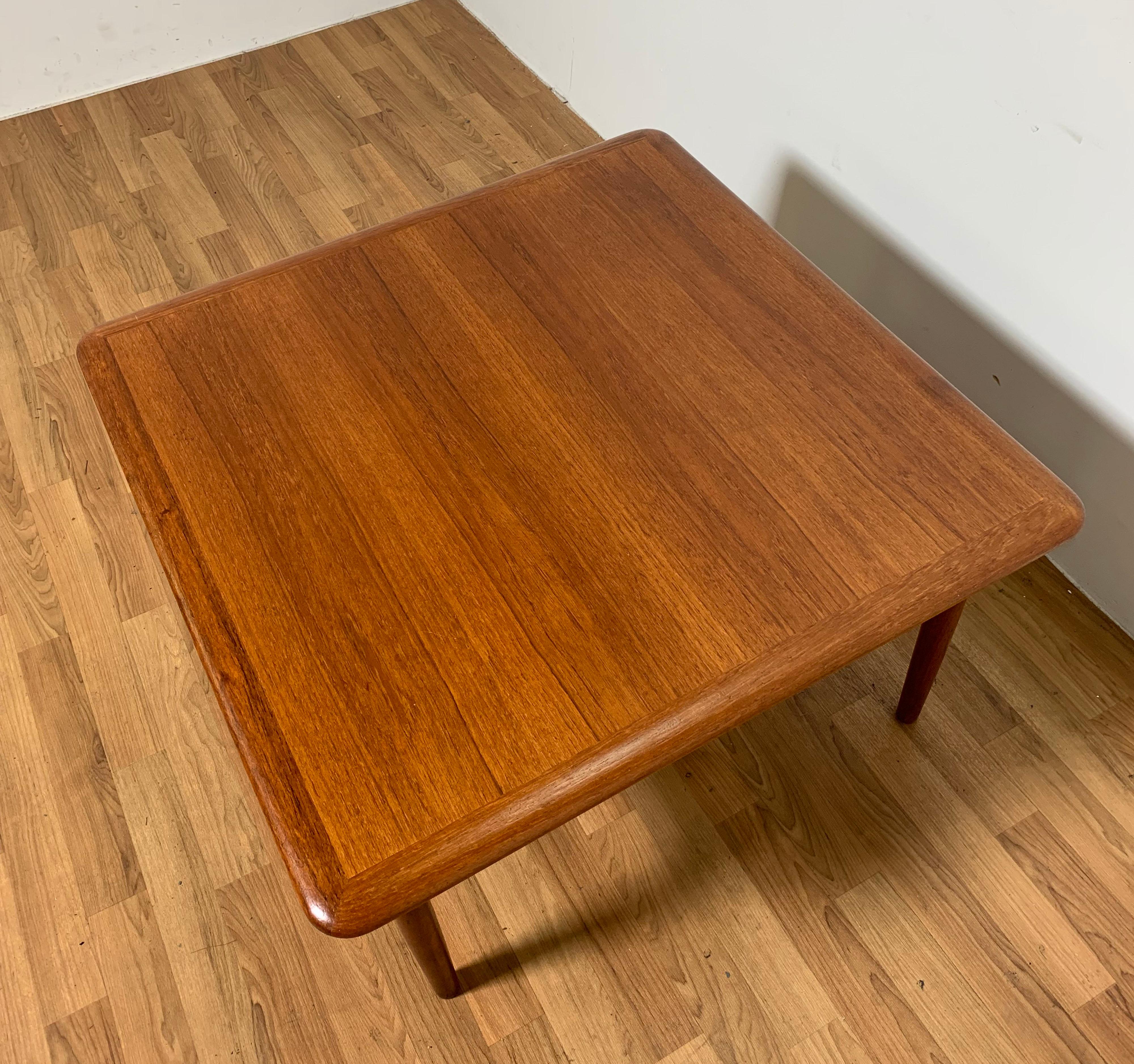 Danish teak coffee table with rattan undershelf, designed by Kurt Ostervig for Jason Mobler, Model 214, circa 1960s.