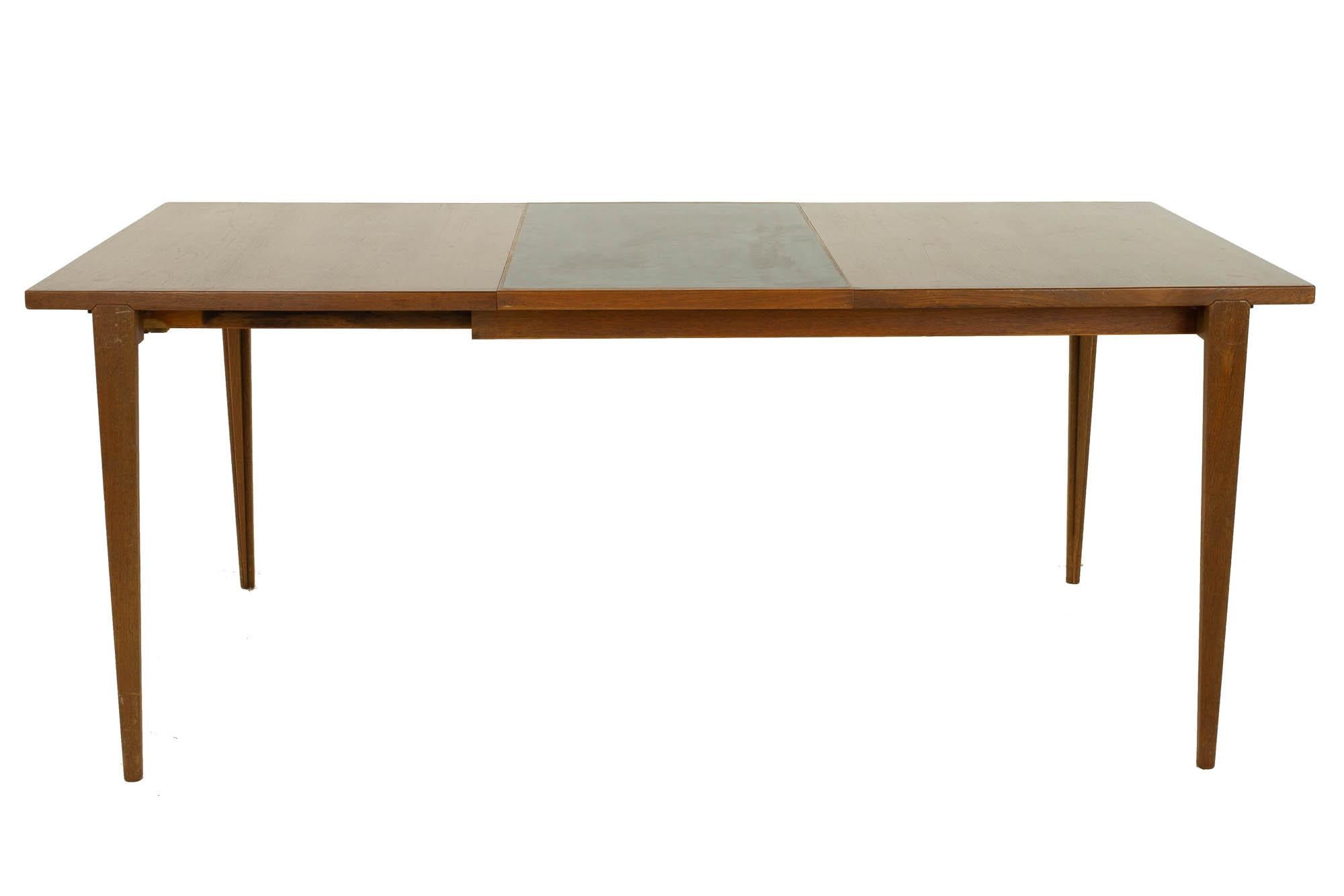 Kurt Ostervig mid century teak dining table

Dining table measures: 51.5 wide x 33.5 deep x 28 inches high, with a chair clearance of 25 inches

?All pieces of furniture can be had in what we call restored vintage condition. That means the piece