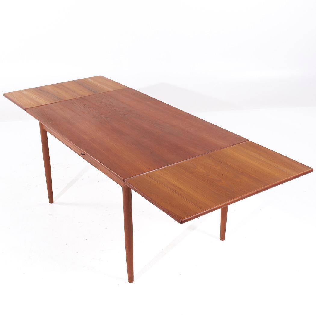 Table de salle à manger en teck à feuilles cachées, style Kurt Ostervig, milieu de siècle en vente 3