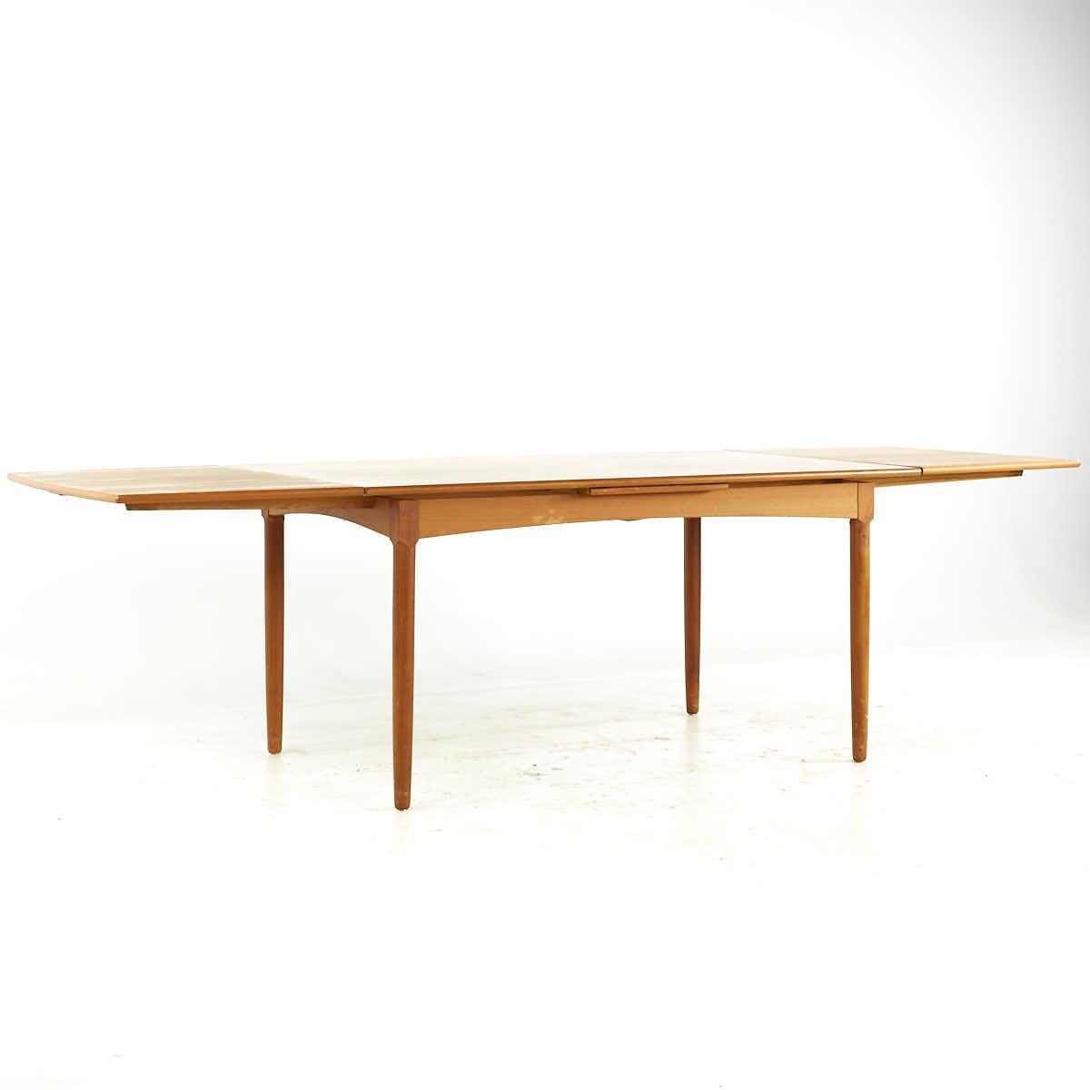 Late 20th Century Kurt Ostervig Style Mid Century Teak Hidden Leaf Dining Table For Sale