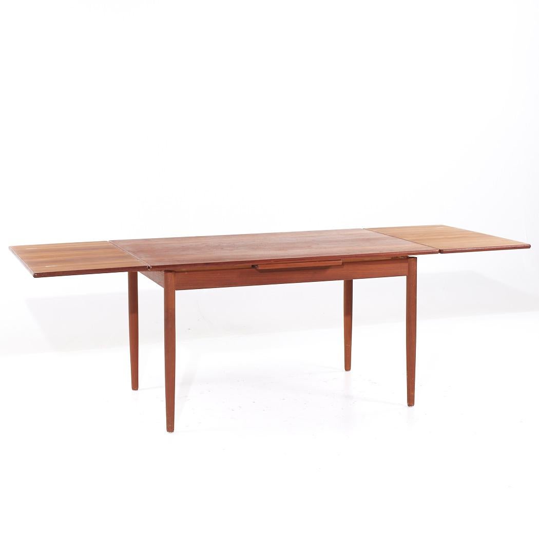 Teck Table de salle à manger en teck à feuilles cachées, style Kurt Ostervig, milieu de siècle en vente