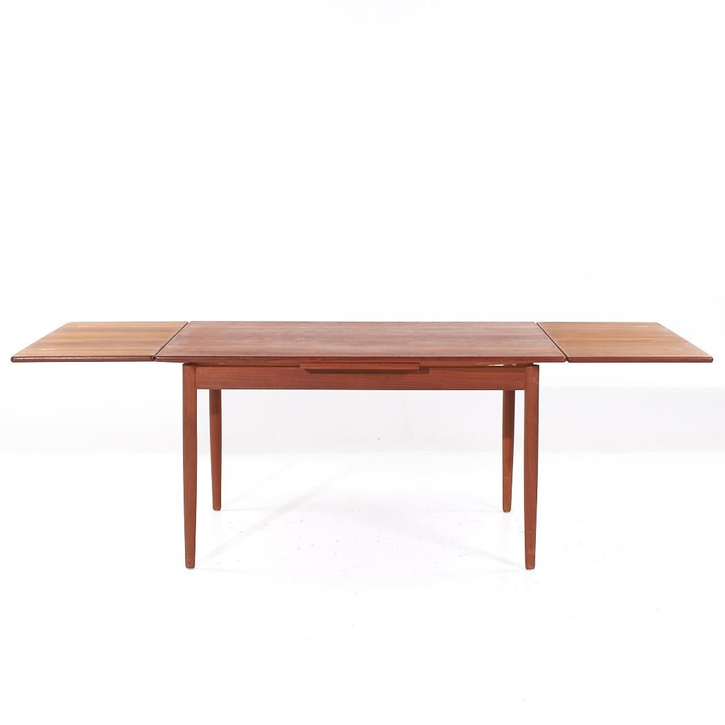 Table de salle à manger en teck à feuilles cachées, style Kurt Ostervig, milieu de siècle en vente 1