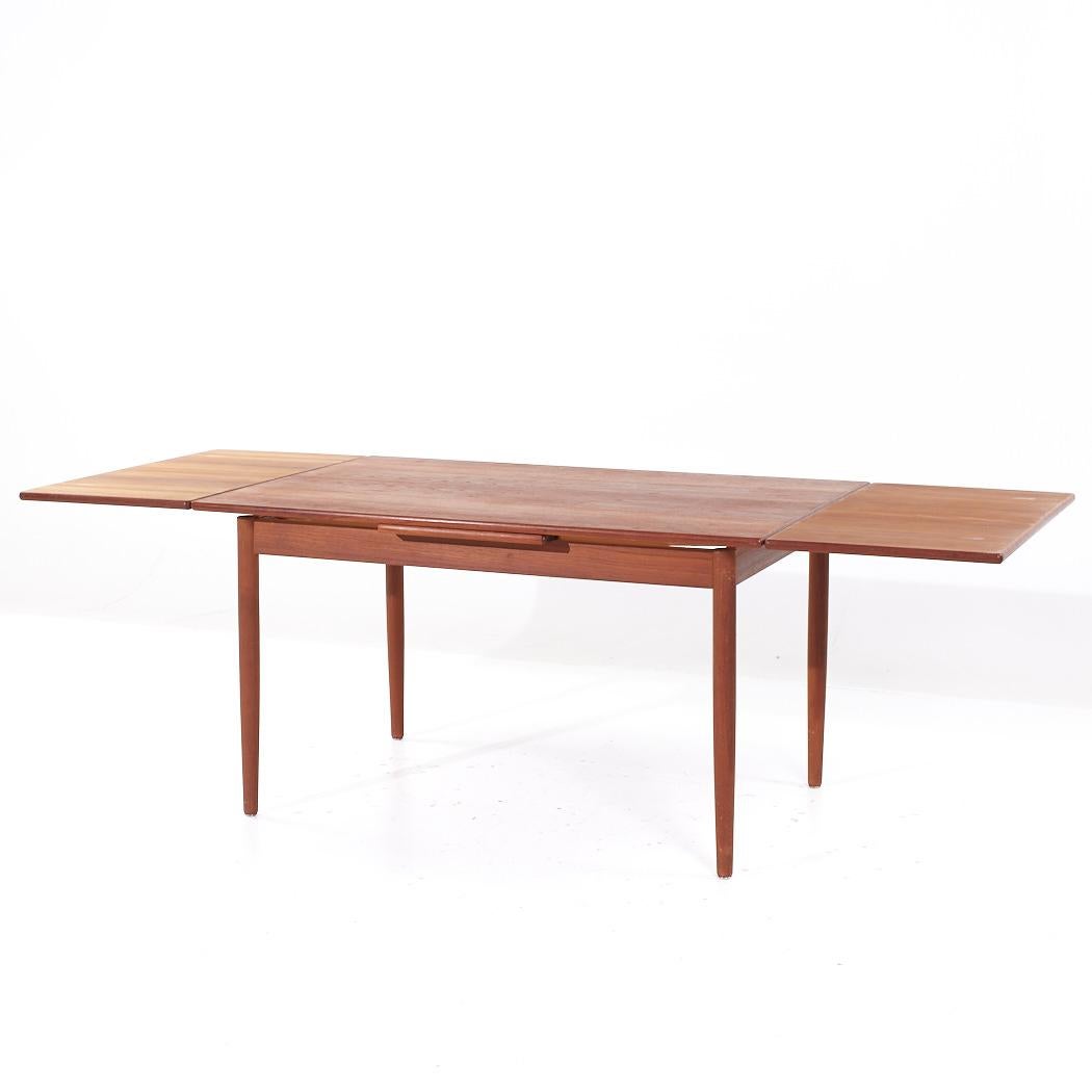 Table de salle à manger en teck à feuilles cachées, style Kurt Ostervig, milieu de siècle en vente 2