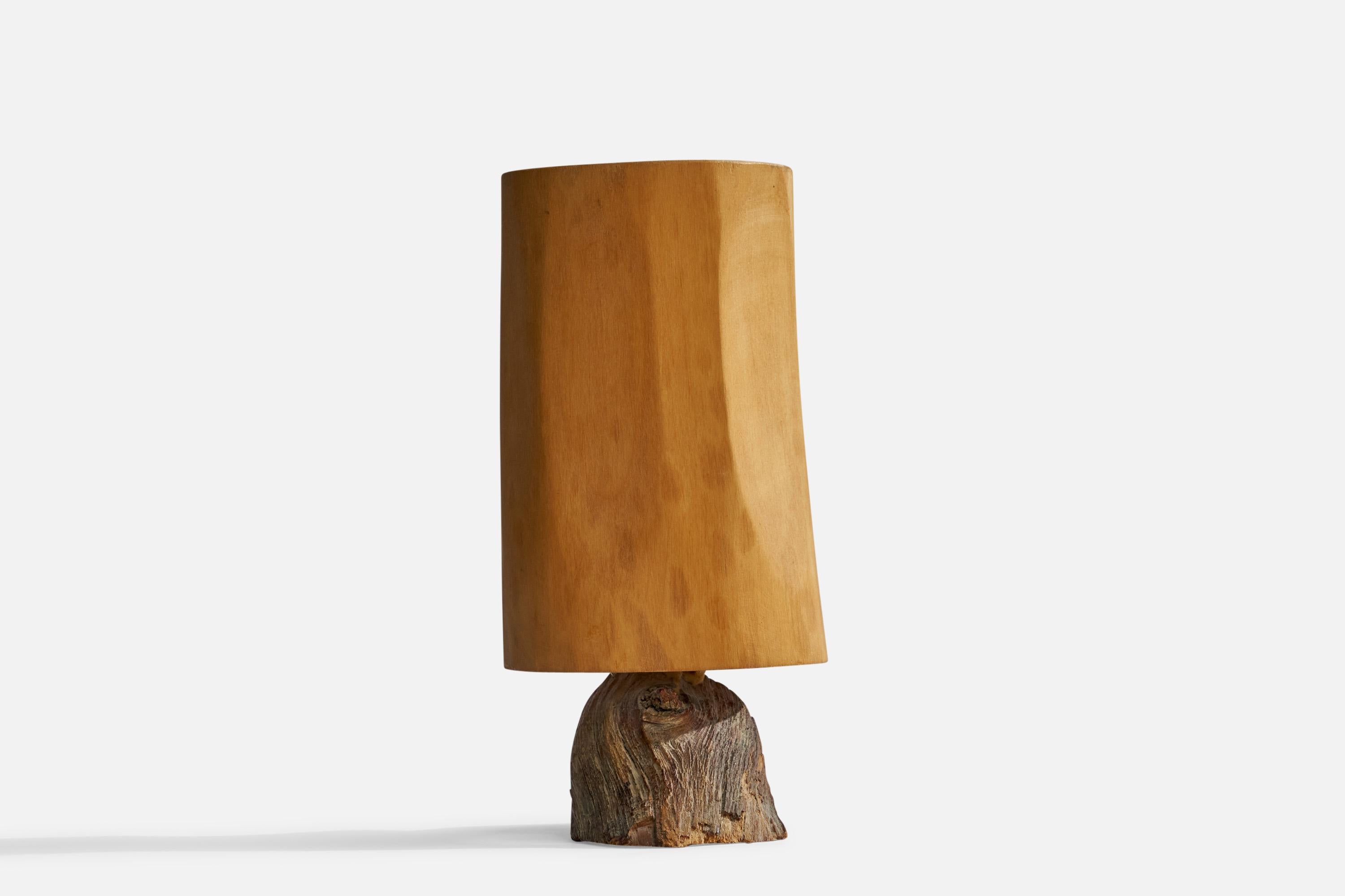 A carved wood and driftwood table lamp designed and produced by Kurt Schmidt, Sweden, dated 1980.

Overall Dimensions (inches): 8”  H x 4.75”  W x 3.5”  D
Stated dimensions include shade.
Bulb Specifications: E-14 Bulb
Number of Sockets: 1
All