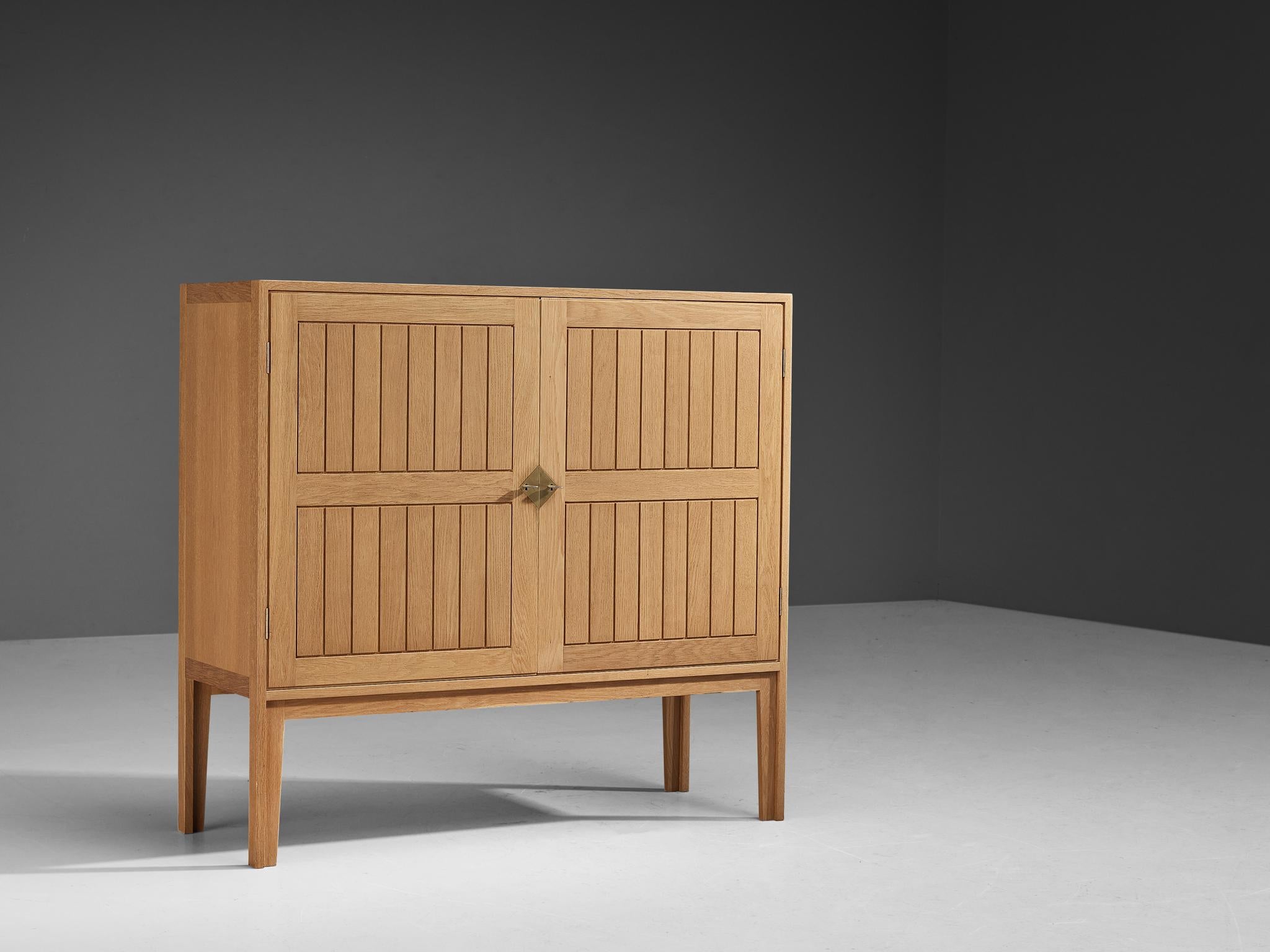 Kurt Østervig, cabinet, oak, Denmark, 1960s

Amazing cabinet by Danish designer Kurt Østervig, made in the 1960s. There are many design elements and detailing that elevate this piece in its appearance and practicality. The front of this piece has