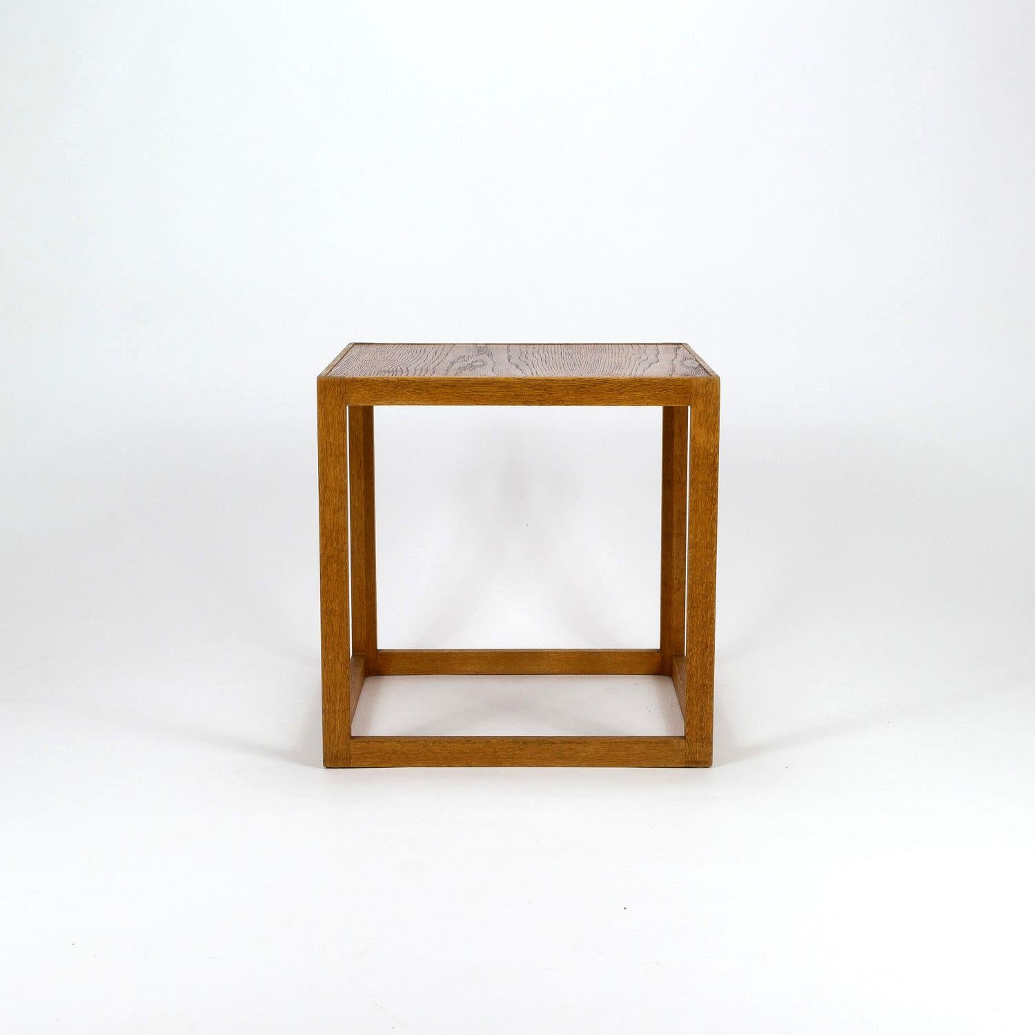 A very rare mid century Kurt Østervig Cube side table in solid oak with laminated oak top made by cabinetmaker Børge Bak, Denmark, 1950s. We also have a version of the Cube table with a teak top - almost a pair! See our 1stdibs Storefront for