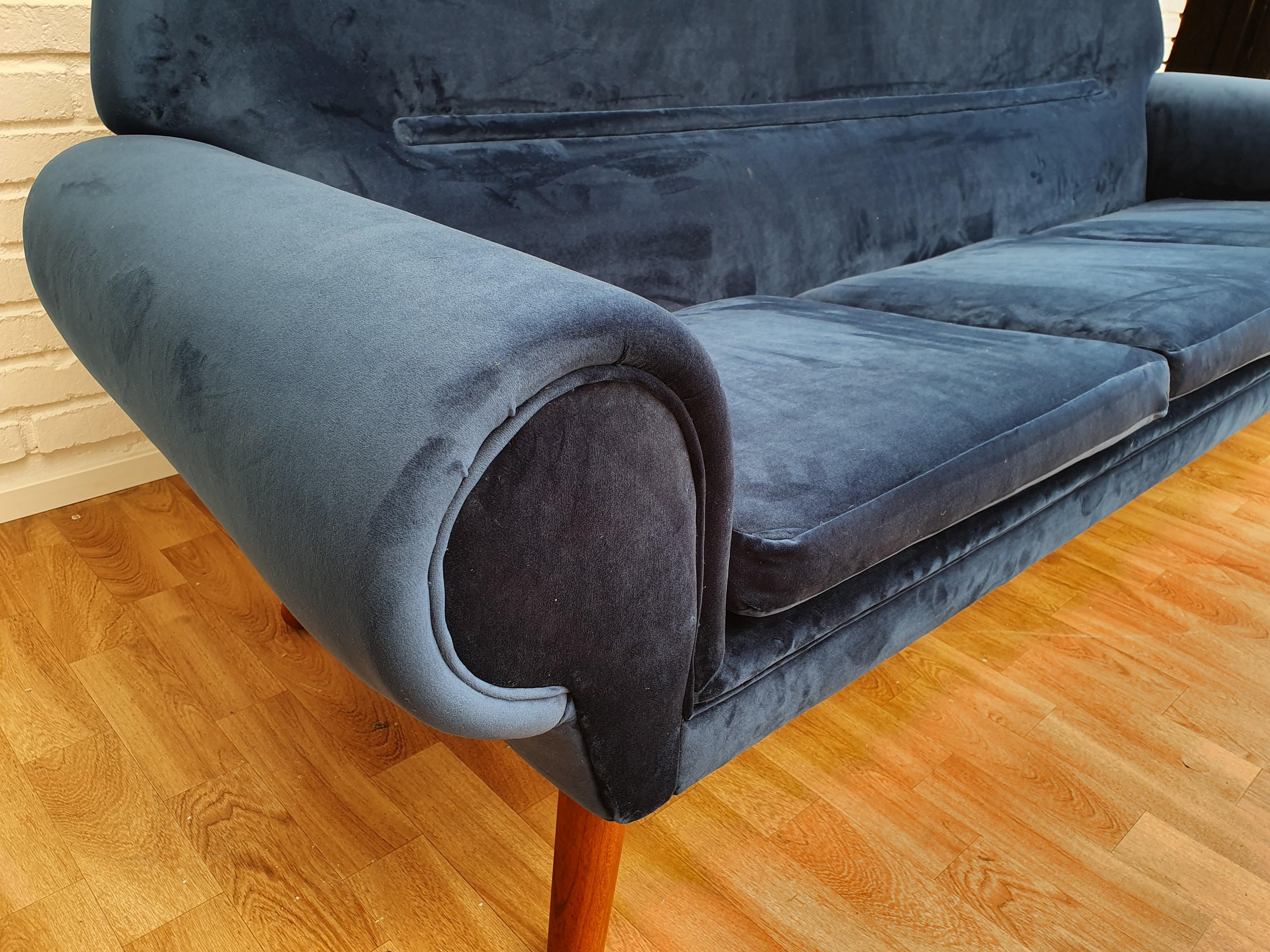 Kurt Østervig, model 14. Danish designed retro 3-seat sofa. Completely renovated (brand new upholstery) and upholstered in quality dark blue velor at Retro Møbler Galleri by furniture craftsmen, upholsterer. Teak legs. Designed 1962. Manufactured by