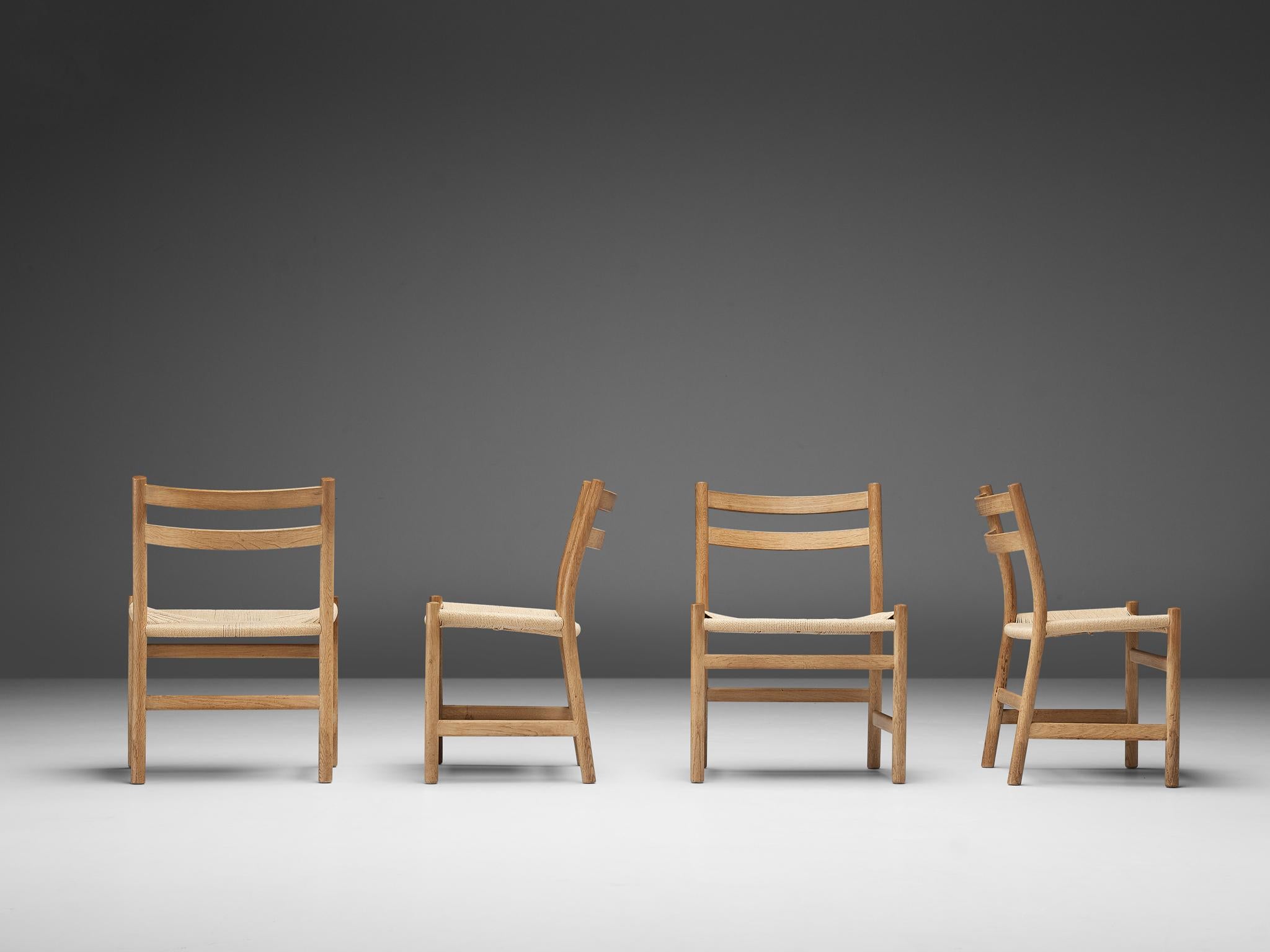 Kurt Østervig for KP Møbler, set of four chairs model KP22, oak, paper cord, Denmark, 1960s

This set of four dining chairs is designed by Kurt Østervig and produced by KP Møbler in the 1960s. This dining set is well executed and quintessentially