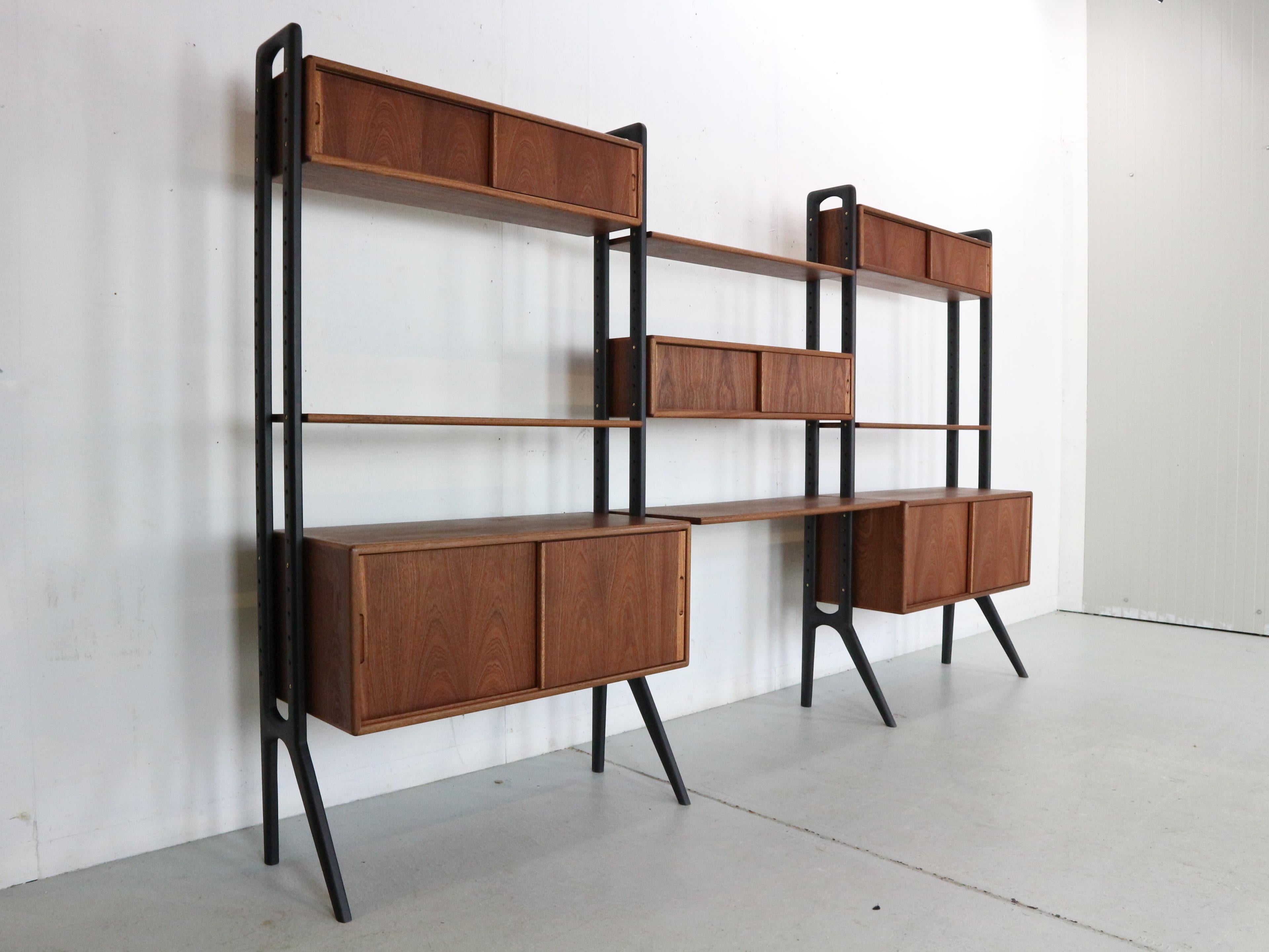 This exceptional Scandinavian design free standing wall unit or room divider designed by Kurt Ostervig for KP Mobler, 1960's Denmark.
Made of solid teak wood.
Originally marked and even has a serial number.
This gorgeous, teak system is fully