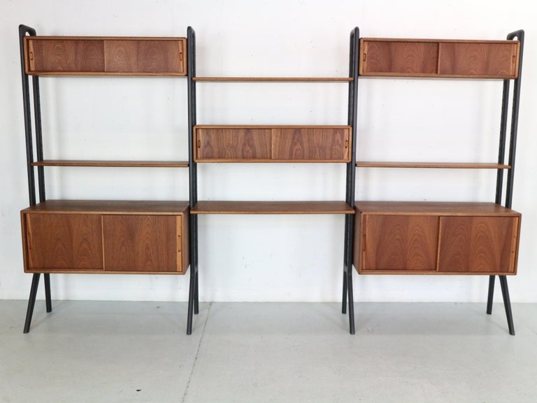 This exceptional Scandinavian design free standing wall unit or room divider designed by Kurt Ostervig for KP Mobler, 1960's Denmark.
Made of solid teak wood.
Originally marked and even has a serial number.
This gorgeous, teak system is fully