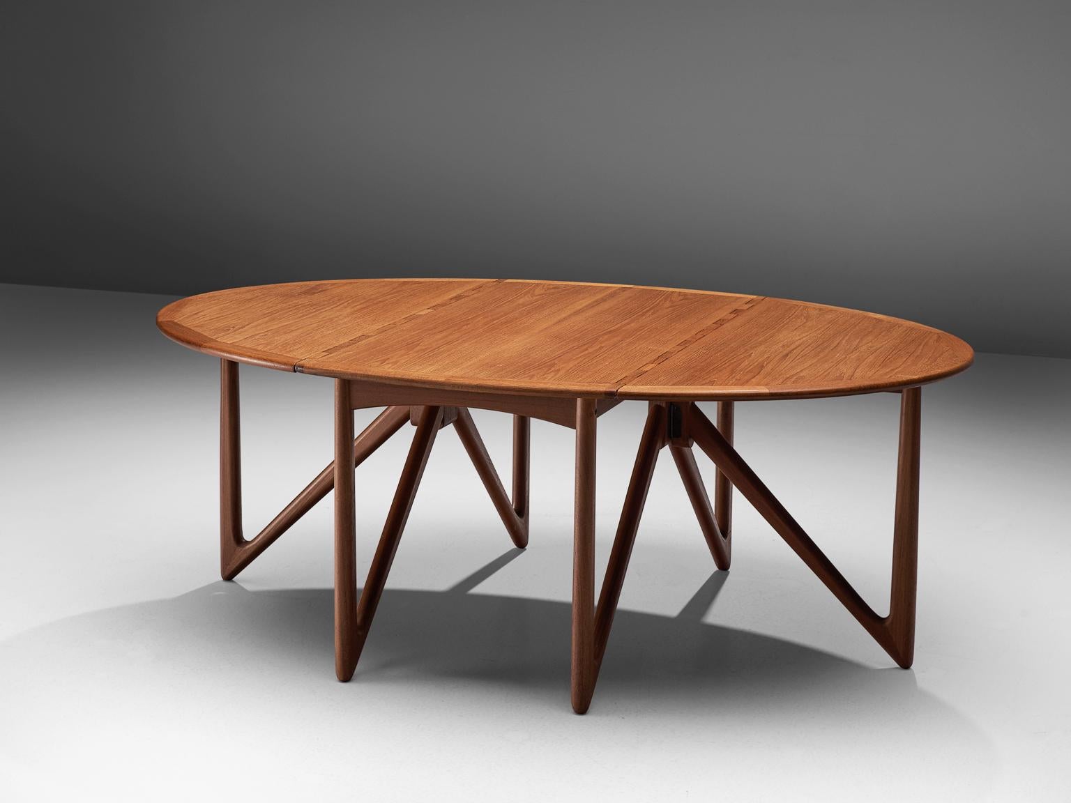 Kurt Østervig for Jason Mobler modern, oval table in teak, Denmark, 1960s.

This rare drop-leaf table shows an unusual, impressive base of six V-shaped legs, made with extraordinary craftsmanship. The clear shape of the oval top nicely contrasts to