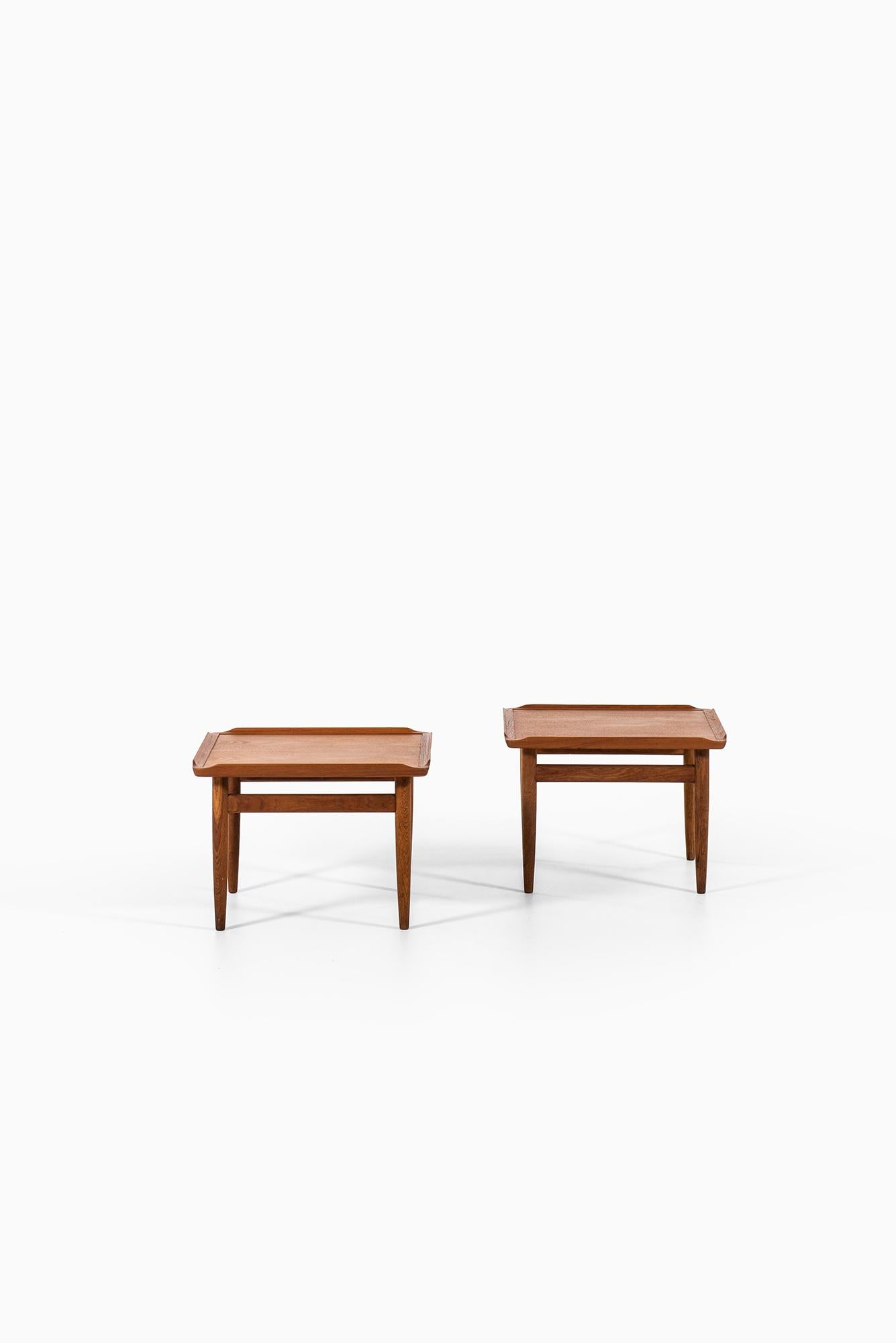 Rare pair of side tables designed by Kurt Østervig. Produced by Jason møbler in Denmark.