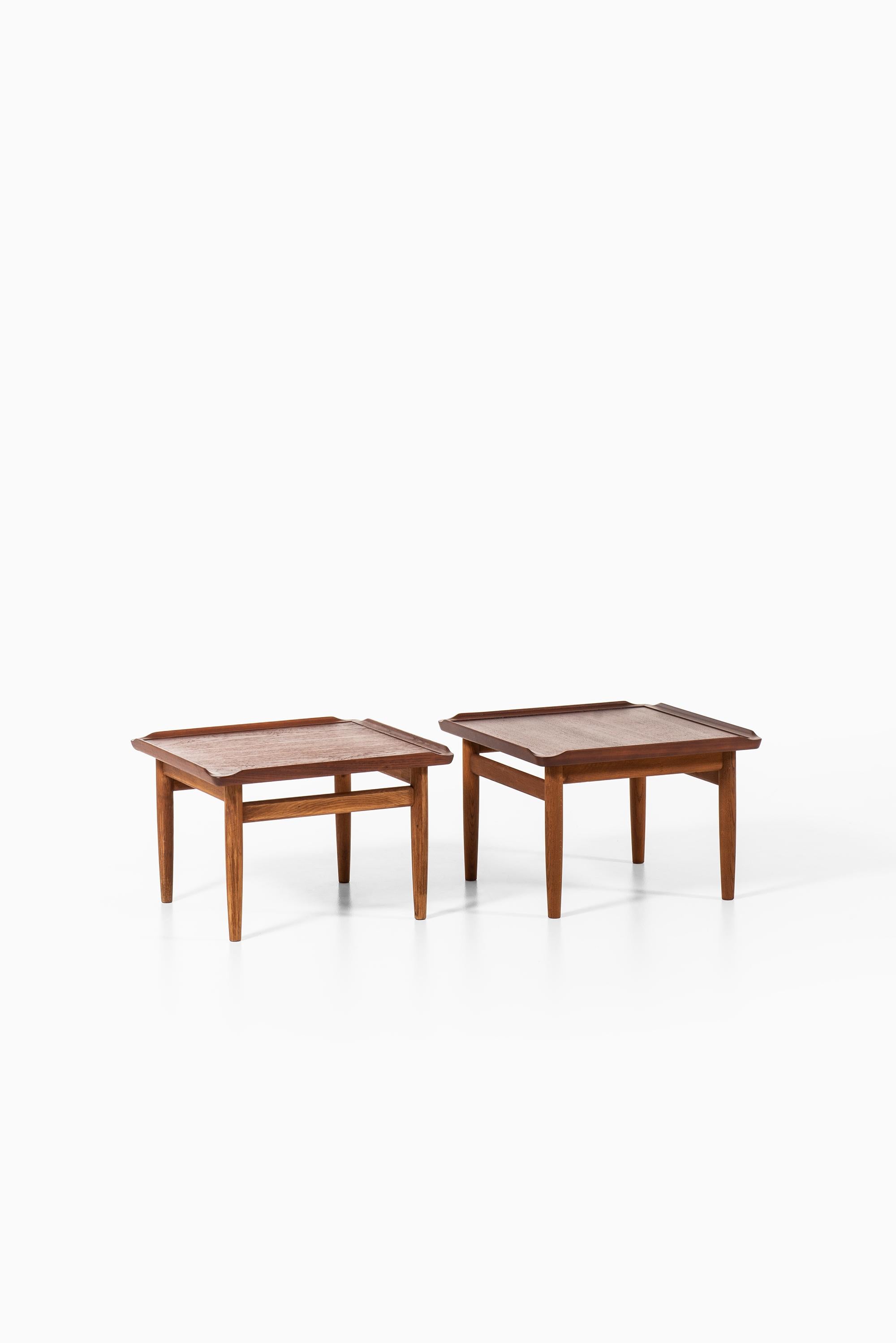 Rare pair of side tables designed by Kurt Østervig. Produced by Jason Møbler in Denmark.