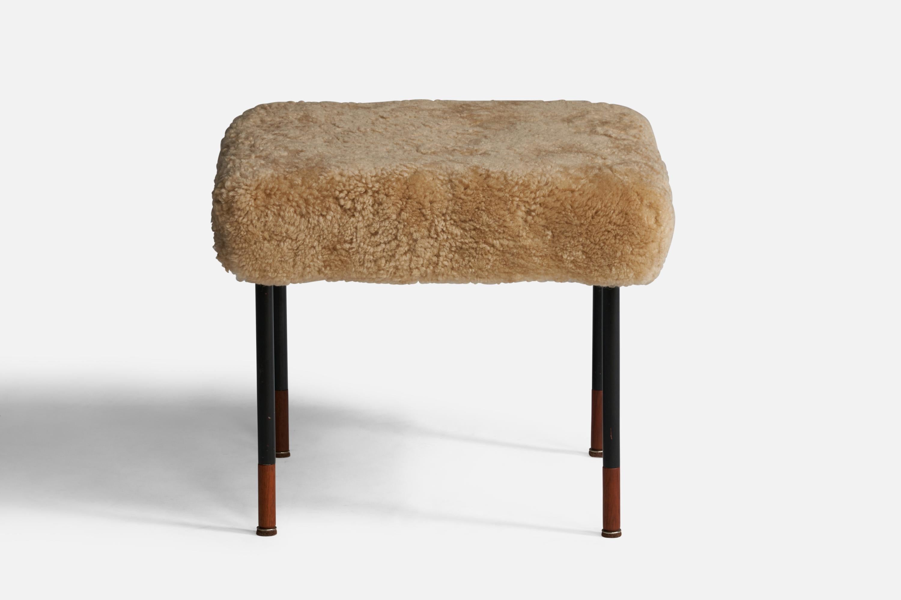 A beige shearling, black-lacquered metal and teak stool designed by Kurt Østervig and produced by Jason Møbler, Denmark, c. 1950s.

Seat height: 18”
