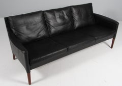 Kurt Østervig three seater sofa, original black leather and rosewood. 1960s