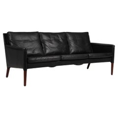 Kurt Østervig three seater sofa, original black leather and rosewood. 1960s