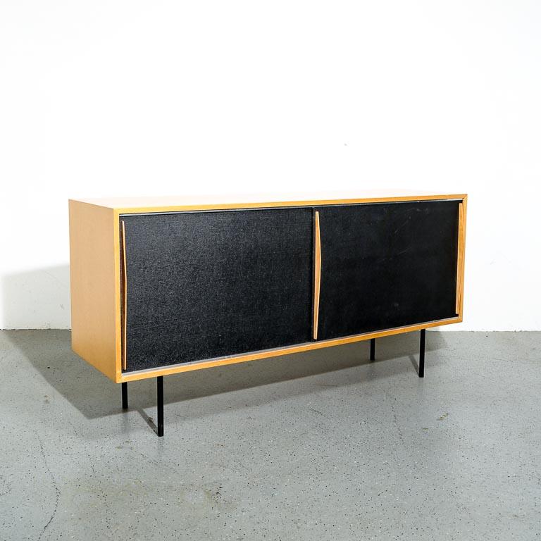 Kurt Thut, a Swiss furniture designer renowned for his innovative and timeless creations, has left an indelible mark on the world of design. One of his standout pieces is a sideboard that seamlessly blends functionality with a distinct
