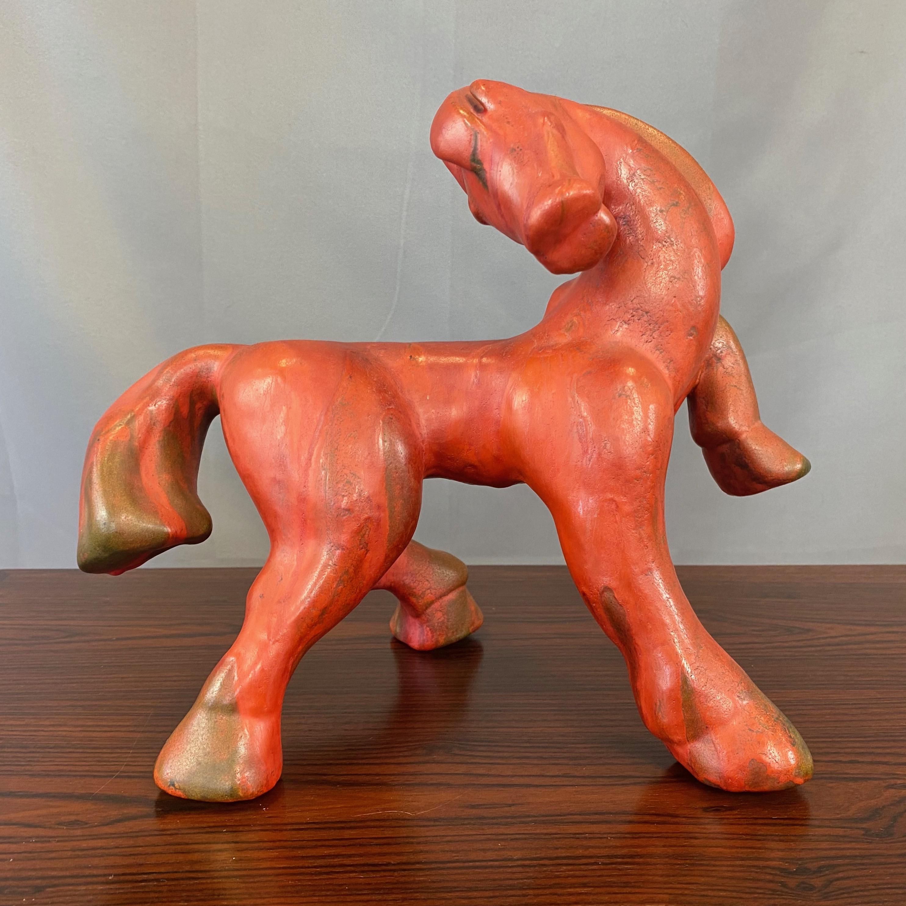 An uncommon 1960s “Vulkano” glazed ceramic horse by Kurt Tschörner for notable West German pottery studio Ruscha Keramik.

Very lively stylized sculpture of a horse with head thrown back and left leg raised displays strikingly powerful elegance