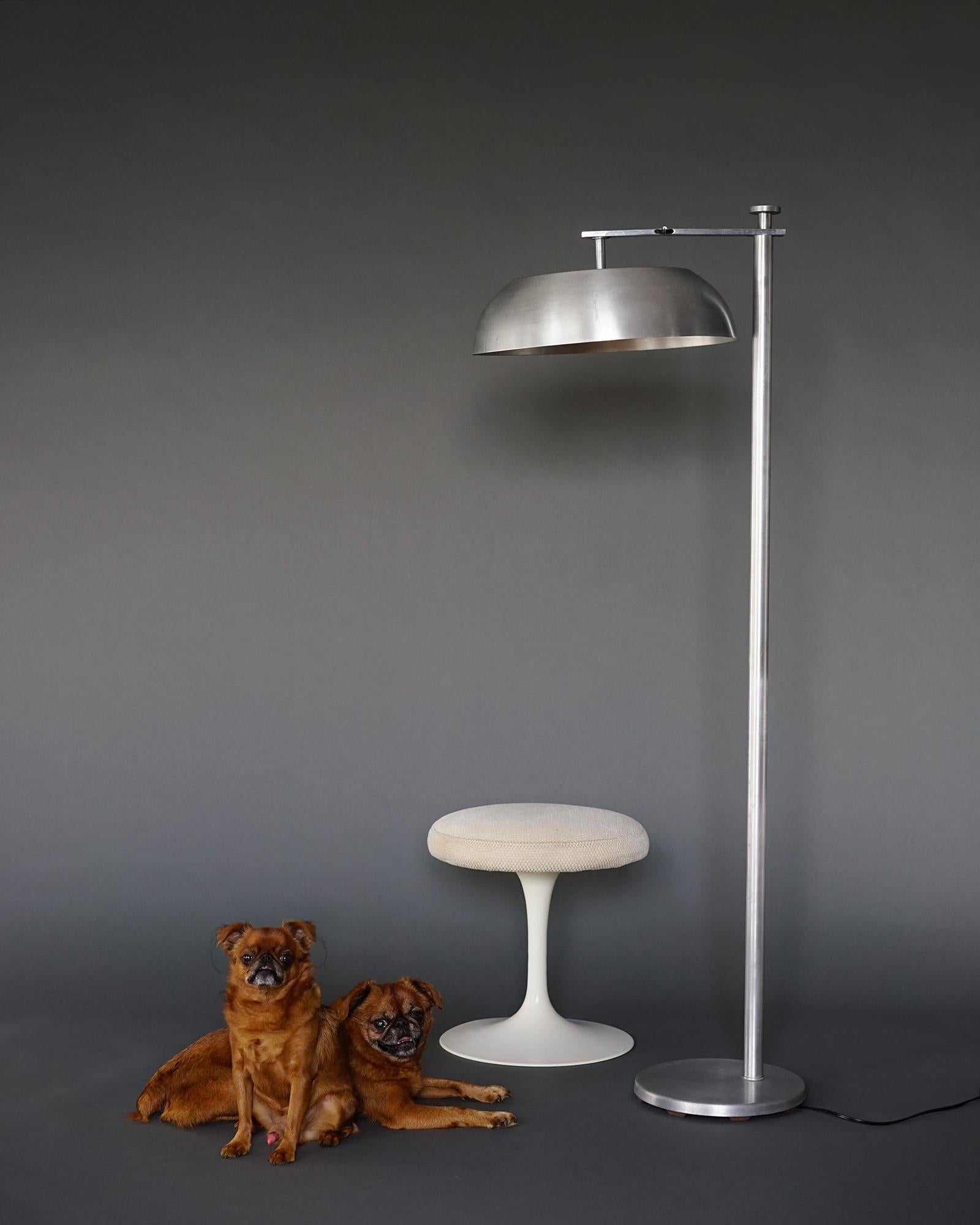 We offer free curbside viewing of this item within the 5 boroughs of New York City or by appointment at our Brooklyn studio.

We have here a handsome and versatile Machine Age floor lamp featuring its original spun aluminium shade which flips