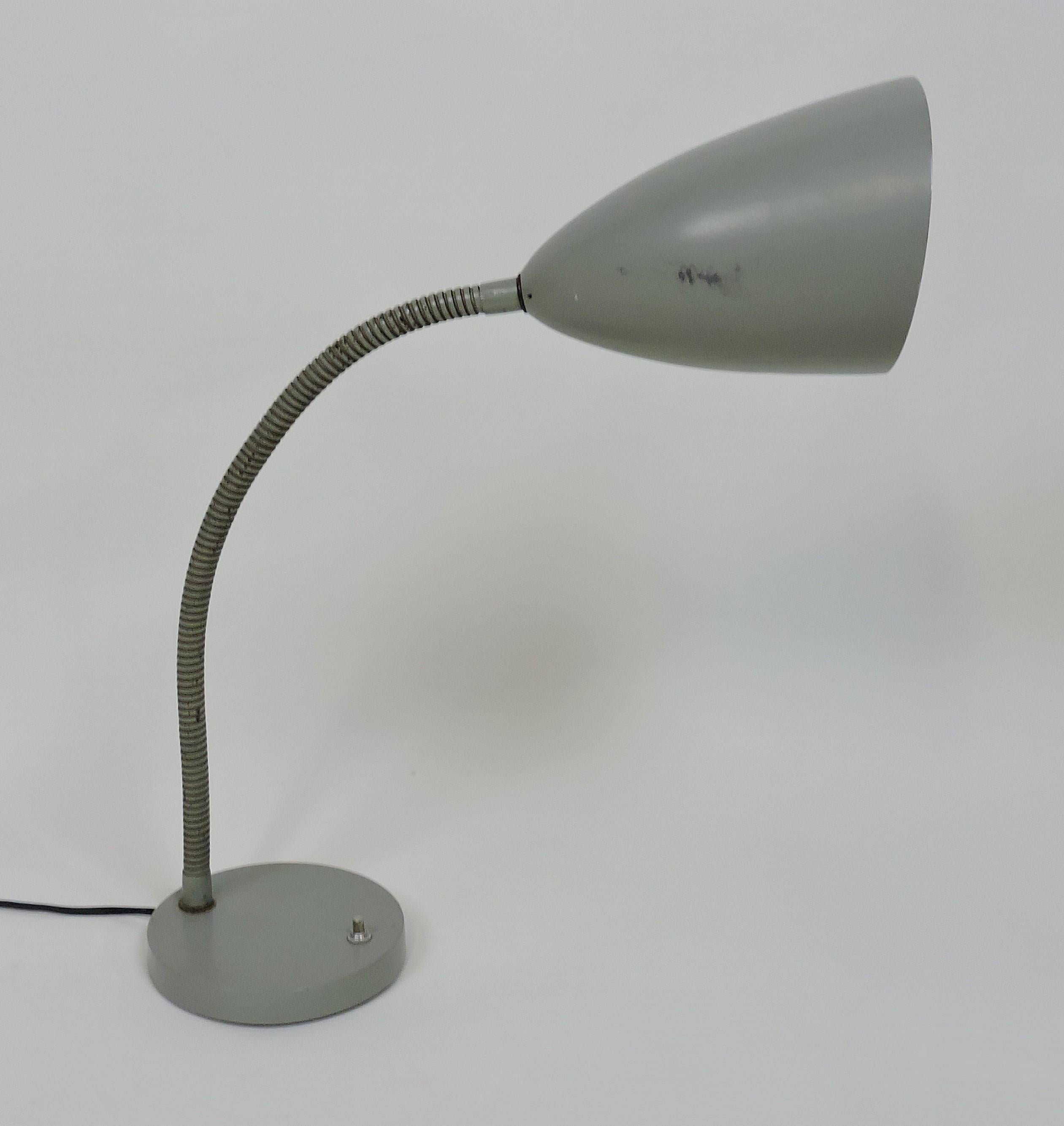 Very cool and practical cone gooseneck desk lamp designed by Kurt Versen. This lamp can be adjusted in an infinite variety of positions so that the light can be directed just where you need it.
