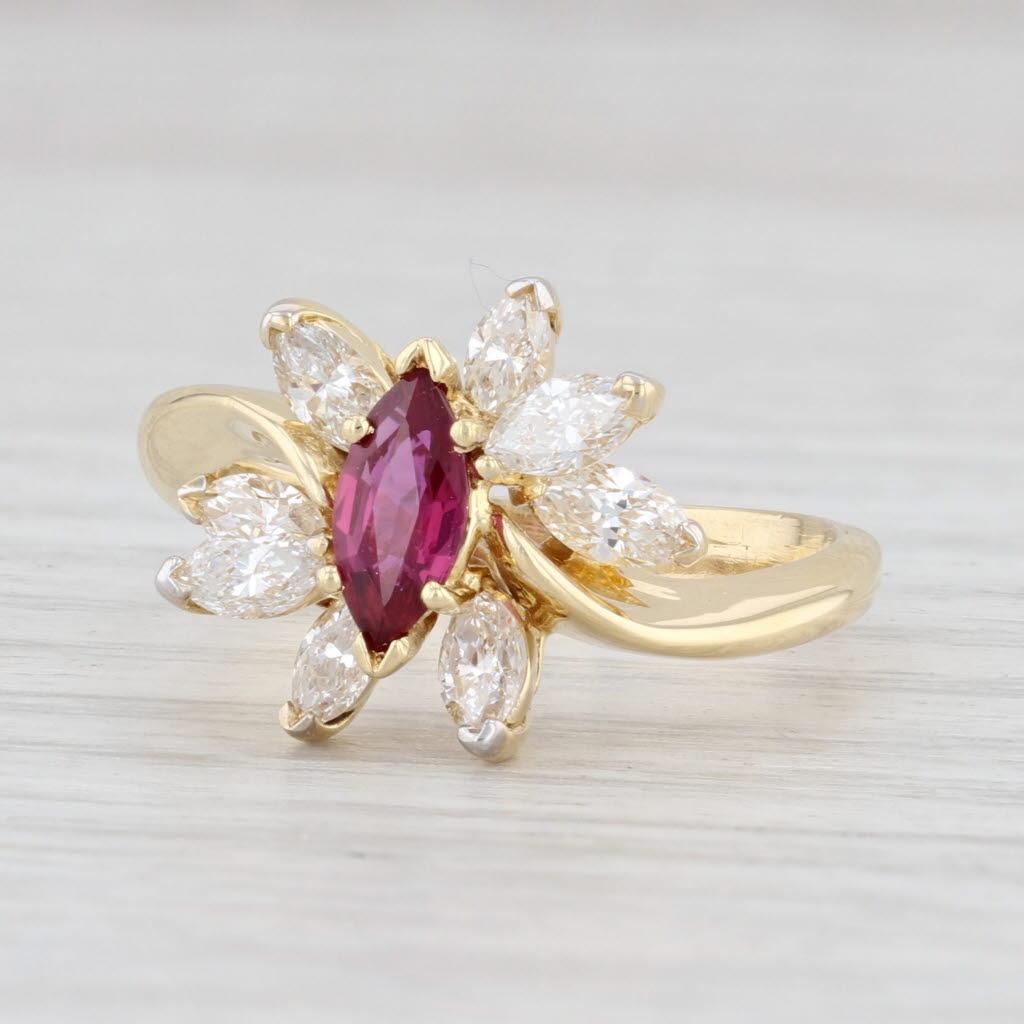 Gem: Natural Ruby - 0.41 Carats, Marquise Brilliant Cut, Red Color, Routinely Enhanced
- Natural Diamonds - 0.74 Total Carats, Marquise Brilliant Cut, F - G Color, VS2 Clarity
Metal: 18k Yellow Gold
Weight: 5.3 Grams 
Stamps: 750
Face Height: 12.7