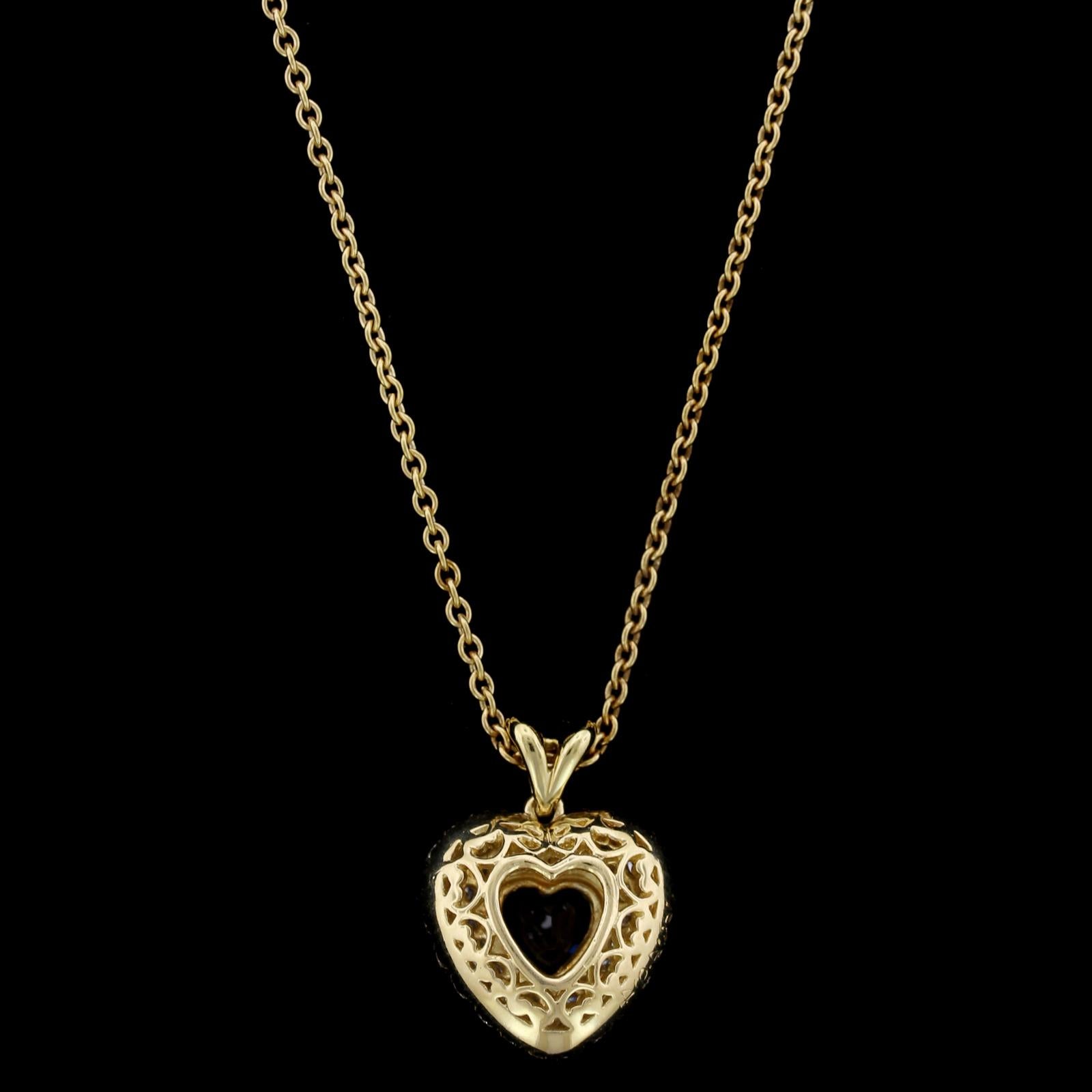 Kurt Wayne 18K Yellow Gold Sapphire and Diamond Heart Pendant. The pendant is bezel set with a heart shaped sapphire weighing approx. .75cts., and pave set with 60 full cut diamonds, approx. total wt. 1.00cts., FG color, VS clarity, #73494, 16