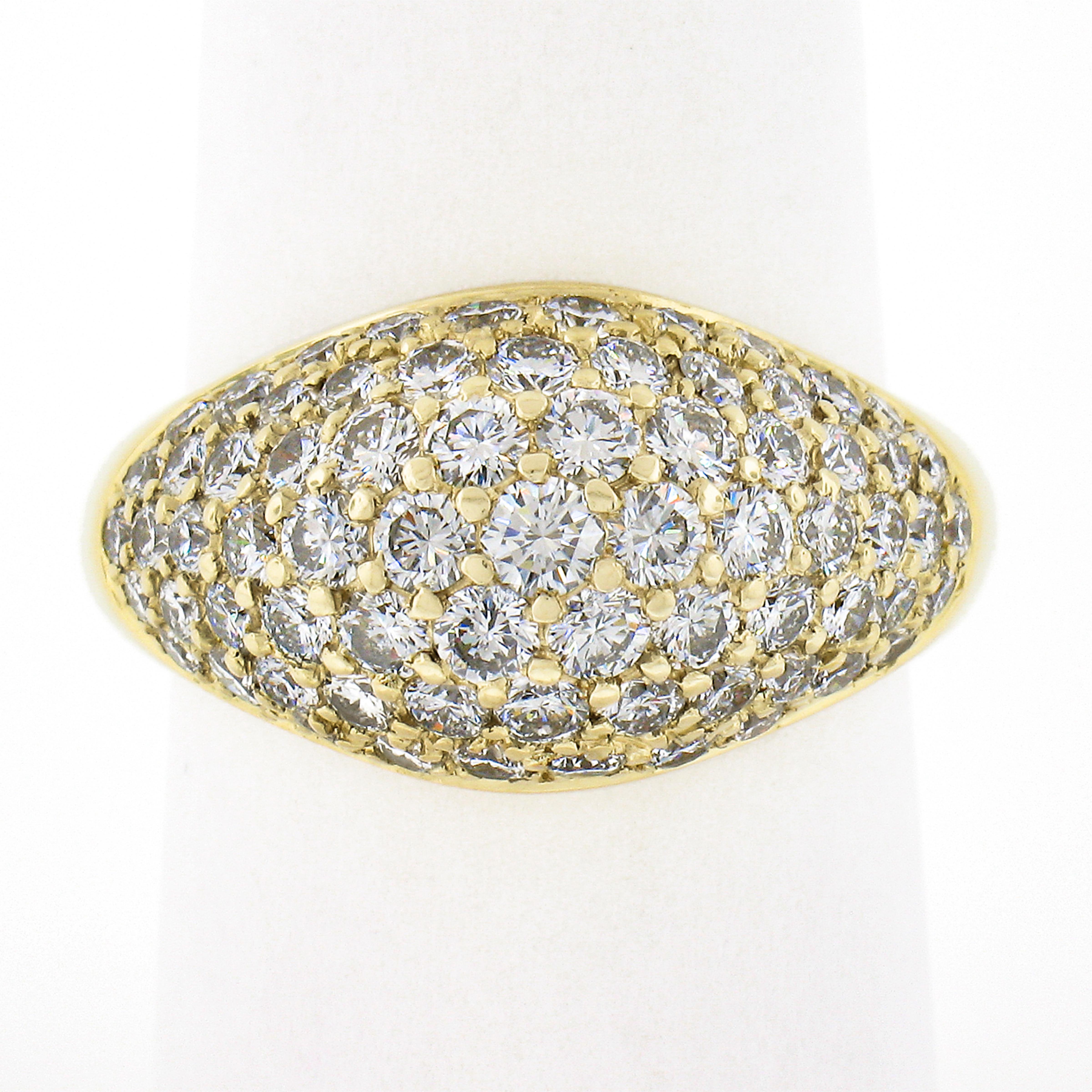 This bold and fiery diamond band ring is well crafted from solid 18k yellow gold. It is completely drenched with approximately 2.25 carats of round brilliant cut diamonds that are perfectly pave set across the dome design. These super fine quality