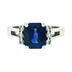 Kurt Wayne: 18 Karat Gold Ring mit blauem Saphir im Smaragdschliff, 3,12 Karat AGL, runder Diamant