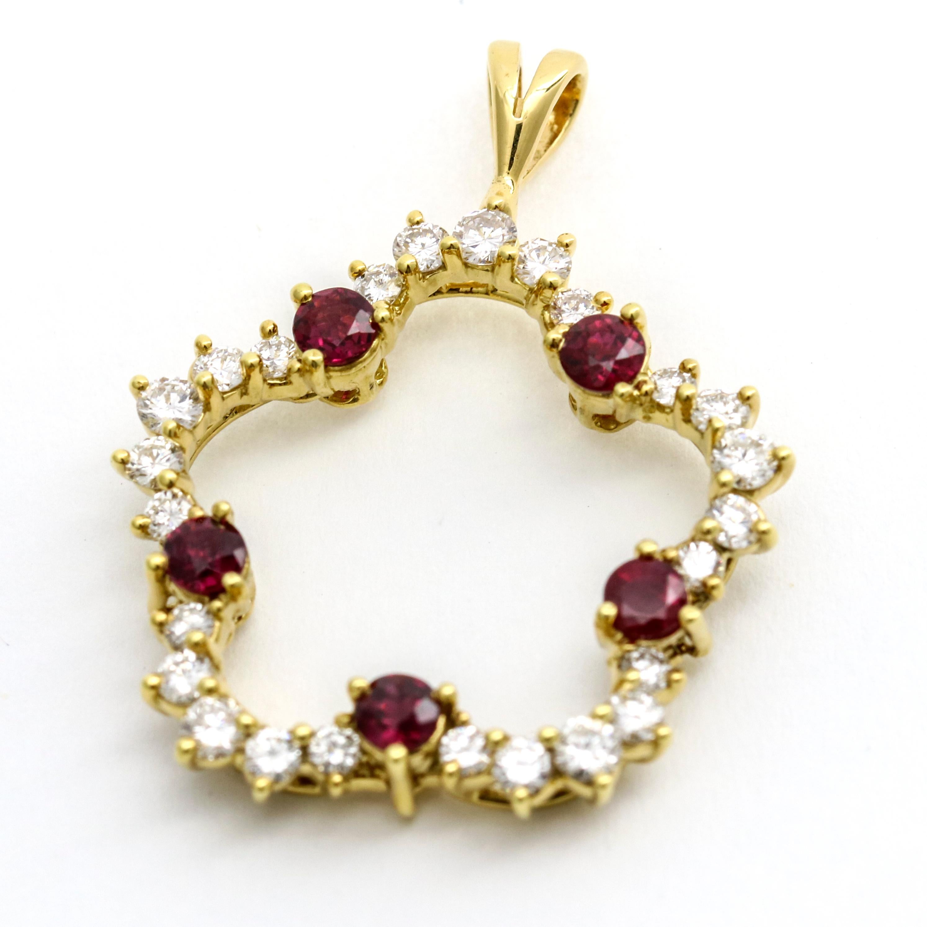 Kurt Wayne diamond and ruby pendant in 18k yellow gold. Originally a brooch modified to wear as pendant. 

Diamond total carat weight, .70 carat. 
Ruby total carat weight, .75 carat.