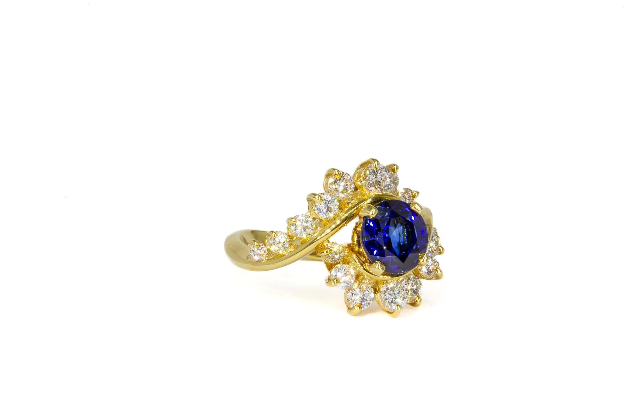 Timeless and sophisticated, this Kurt Wayne 2.02 Carat Round Sapphire and Diamond Ring is a striking statement of elegance. At its center is a vivid 2.02 carat round sapphire, radiating a deep, rich blue hue that captures the eye. Surrounding the