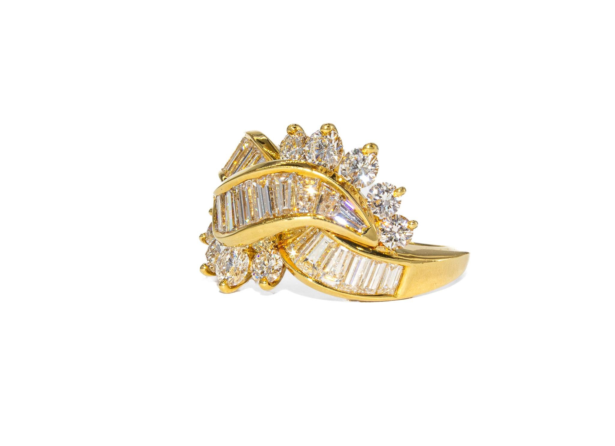 This striking 18K yellow gold ring is a bold yet timeless design, perfect for those who appreciate vintage glamour with a refined edge. The band is set with a total of 10 round brilliant diamonds, weighing 1.05 carats, and 1.70 carats of sleek