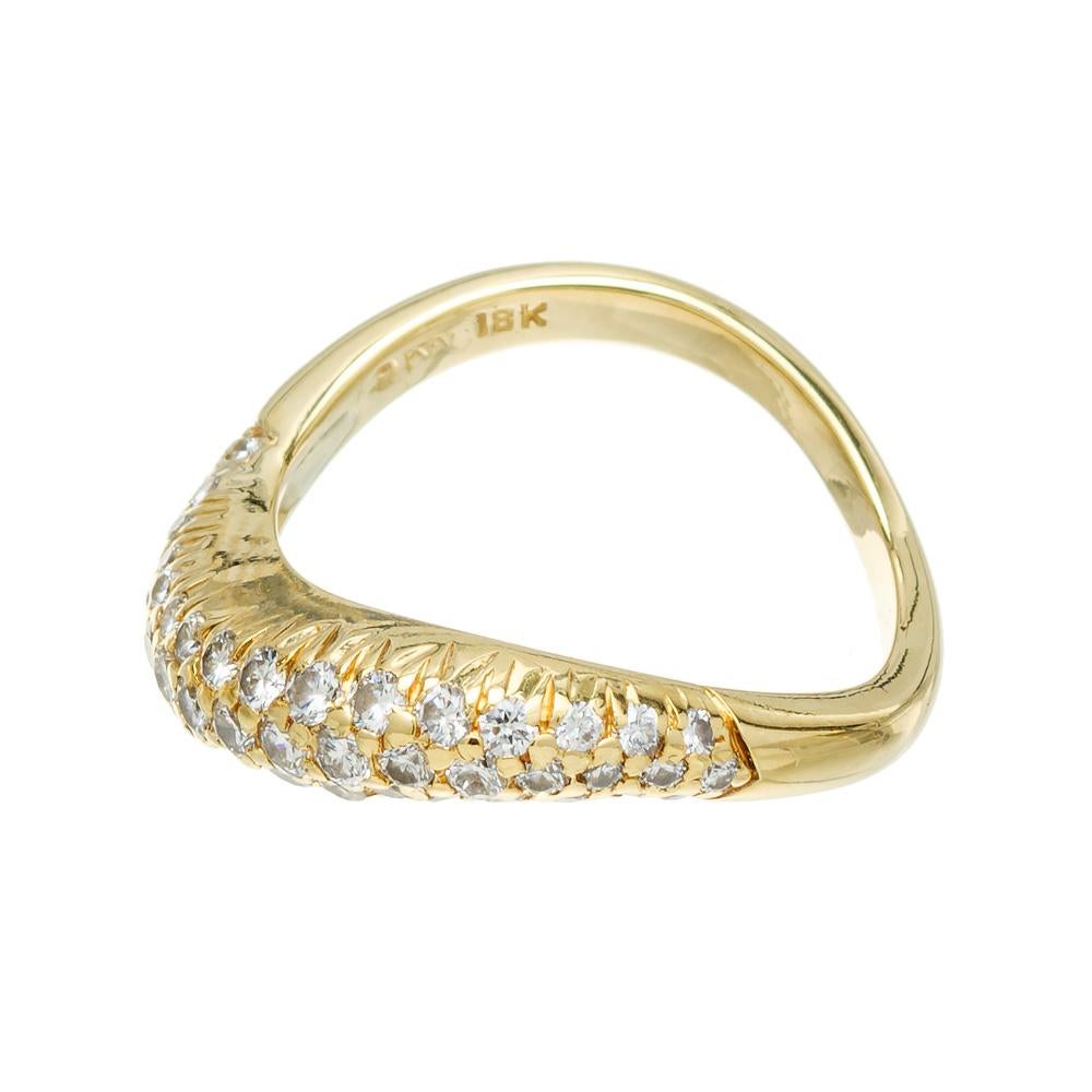 Kurt Wayne pave diamond swirl ring circa 1990. 49 mixed sized diamonds set in 18k yellow gold. 

49 mixed size round diamonds, G-H VS-SI approx. .63cts
Size 6 and sizable 
18k yellow gold 
Stamped: 18k
Hallmark: KW 
4.1 grams
Depth or thickness: