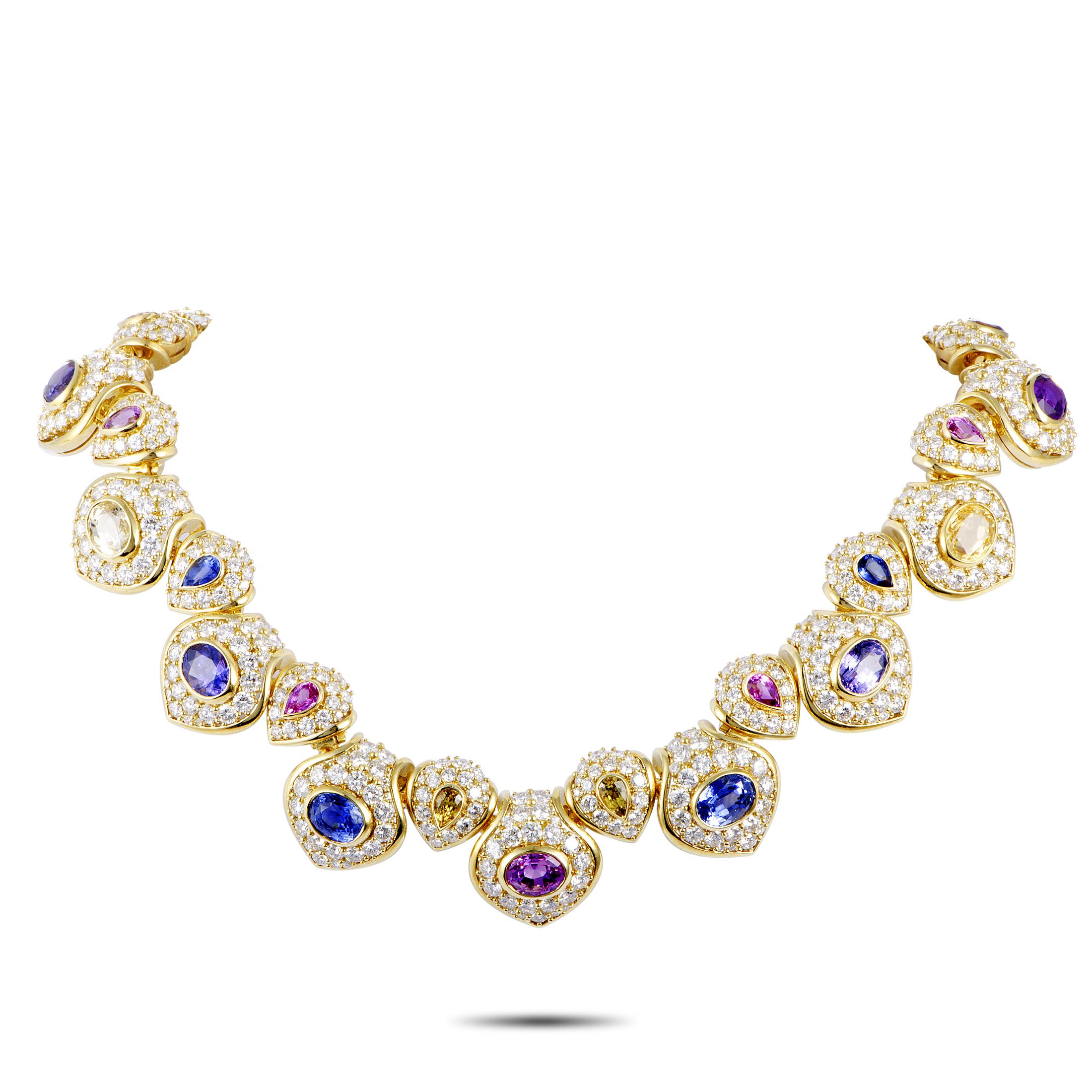 This Kurt Wayne set includes a necklace and a pair of earrings that are crafted from 18K yellow gold and set with yellow, blue and pink sapphires that amount to 55.00 carats, and with a total of approximately 52.00 carats of diamonds boasting F