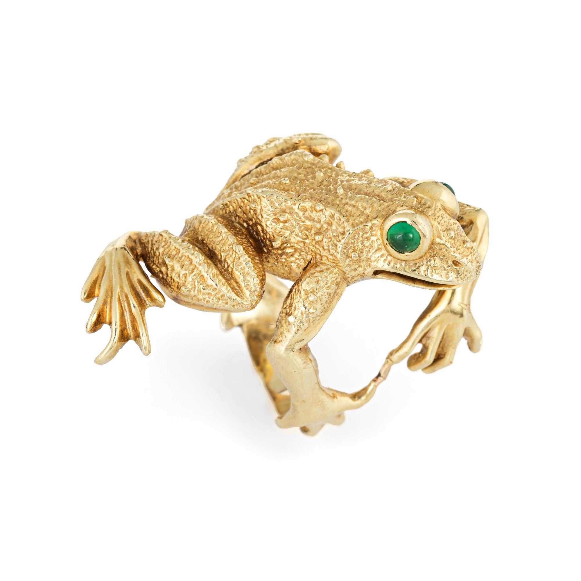 Finely detailed Kurt Wayne Frog ring (circa 1980s) crafted in 18 karat yellow gold. 

Cabochon cut green chalcedony is set into the eyes (estimated at 0.05 carats each - 0.10 carats total estimated weight). The chalcedony is in excellent condition