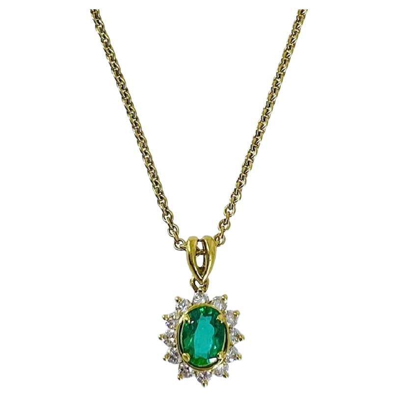 Kurt Wayne Oval Emerald Pendant with Diamond Halo in 18K Yellow Gold For Sale