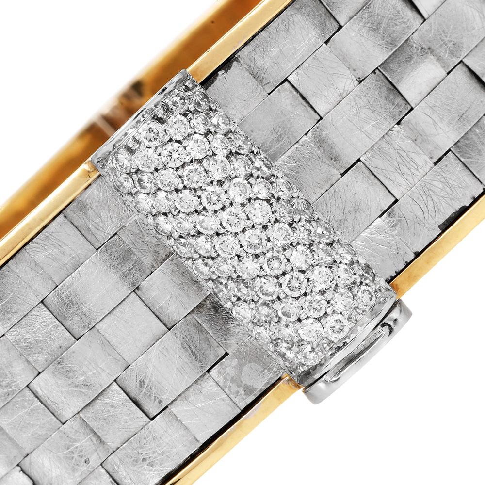 A striking example of handcrafted artistry, this fashionable bangle bracelet by Kurtulan is designed in rich 18K yellow and white gold. The wide band showcases a woven matte-textured surface framed by polished yellow gold edges, highlighting the