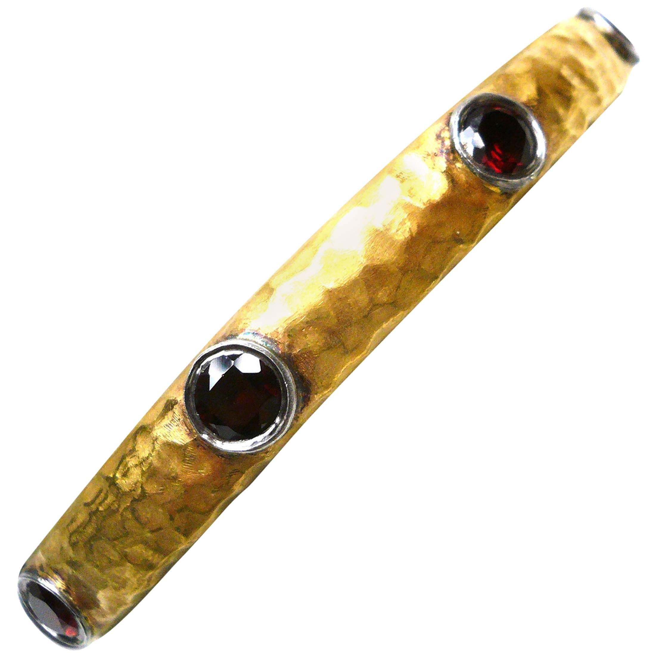 Kurtulan Hammered 24K Gold 
Sterling Silver and Garnet Hinge Bangle Bracelet For Sale