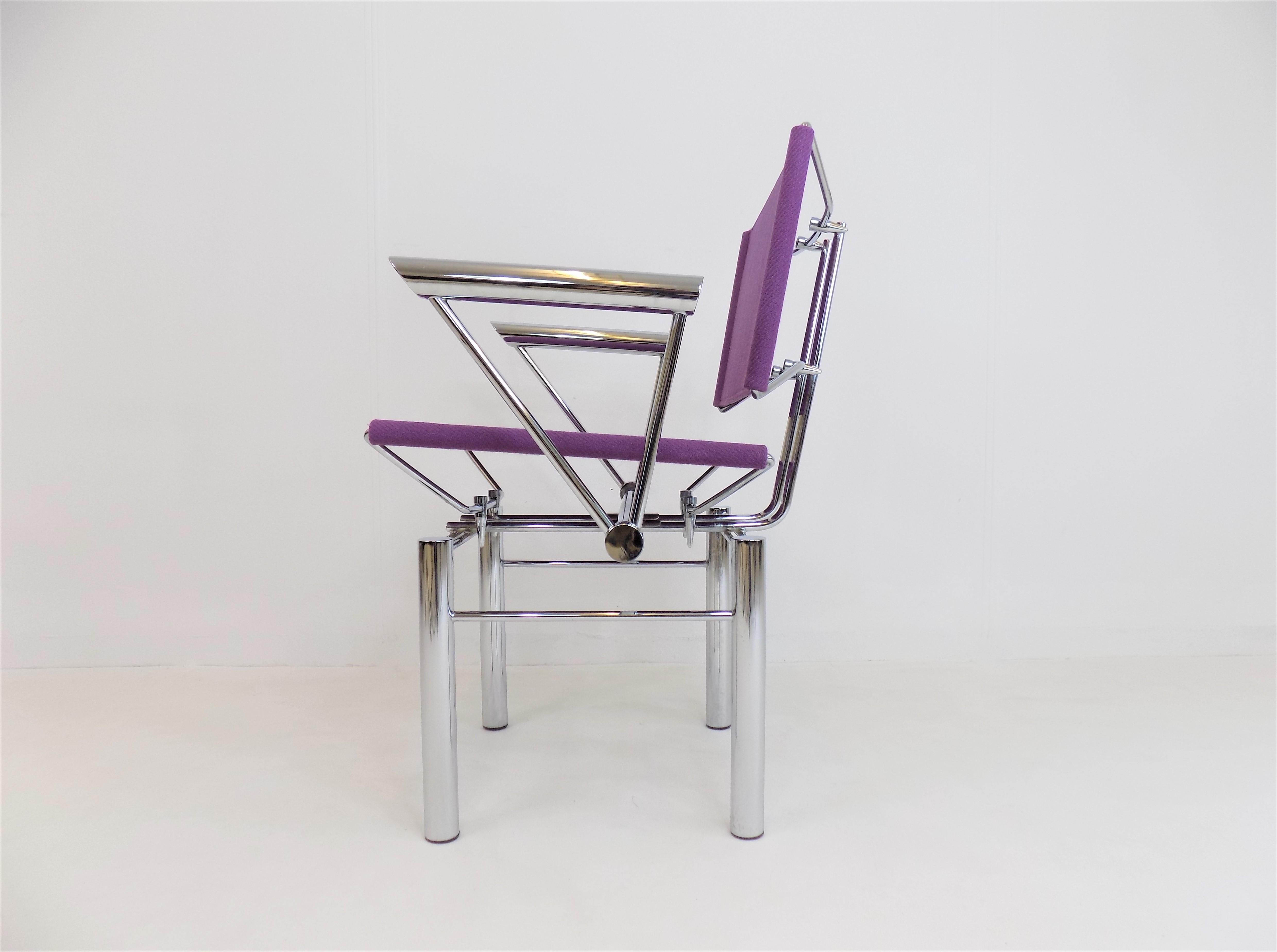 This futuristic-looking Kusch chair 8600 has a chrome-plated metal frame and a purple-colored fabric cover for the seat and backrest. The martial and at the same time airy looking chrome frame shows hardly any signs of wear. The fabric covering is