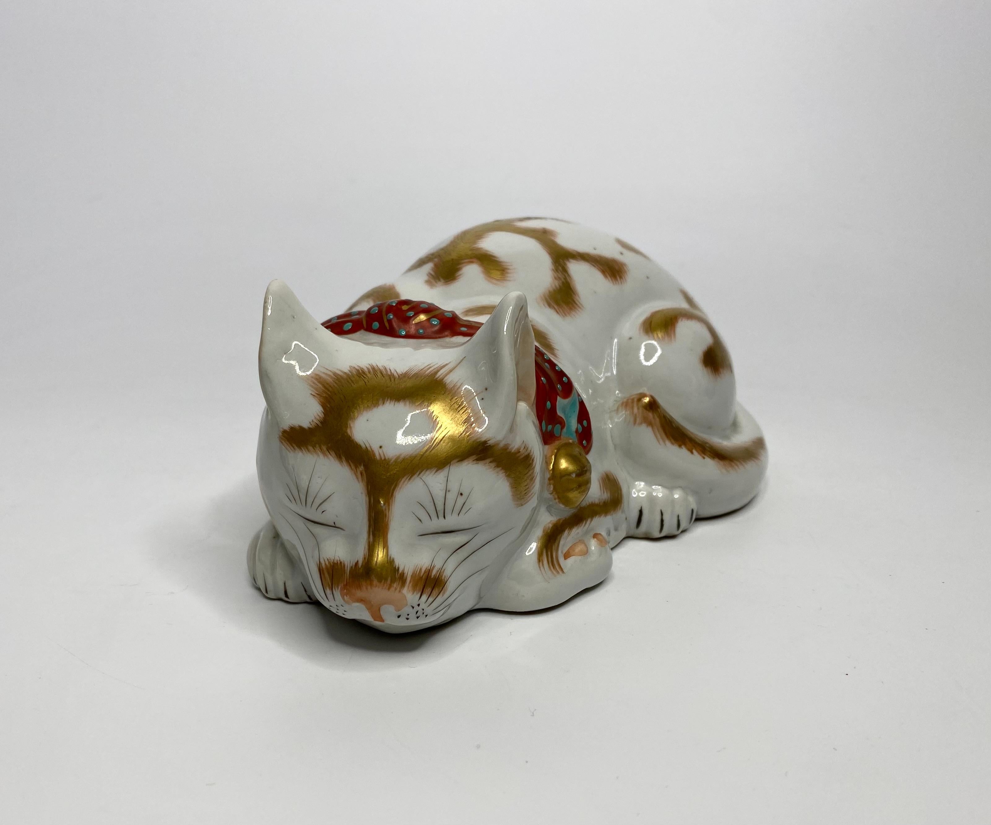 Kutani porcelain okimono of a cat, c. 1900. Meiji Period.

£490.00
Kutani porcelain okimono, Japan, c. 1900. Meiji Period. Finely modelled as a sleeping cat, its hair delineated in gilt. Wearing a fabric collar, enamels in iron red, with a turquoise