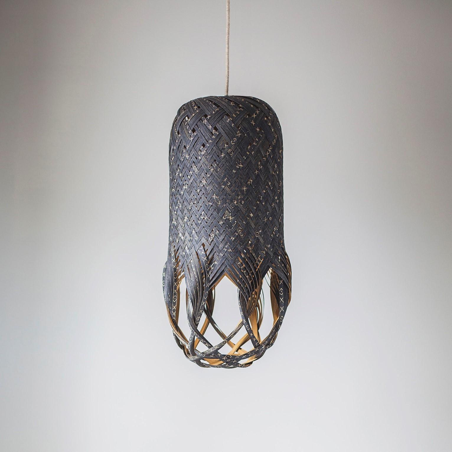 The KUTCH01 pendant light is a unique one-of-a-kind piece.  Handwoven by the artist, Louise Tucker. The light was created as an artistic response to an artist residency in the Kutch desert region in India.  The piece has been carefully crafted out