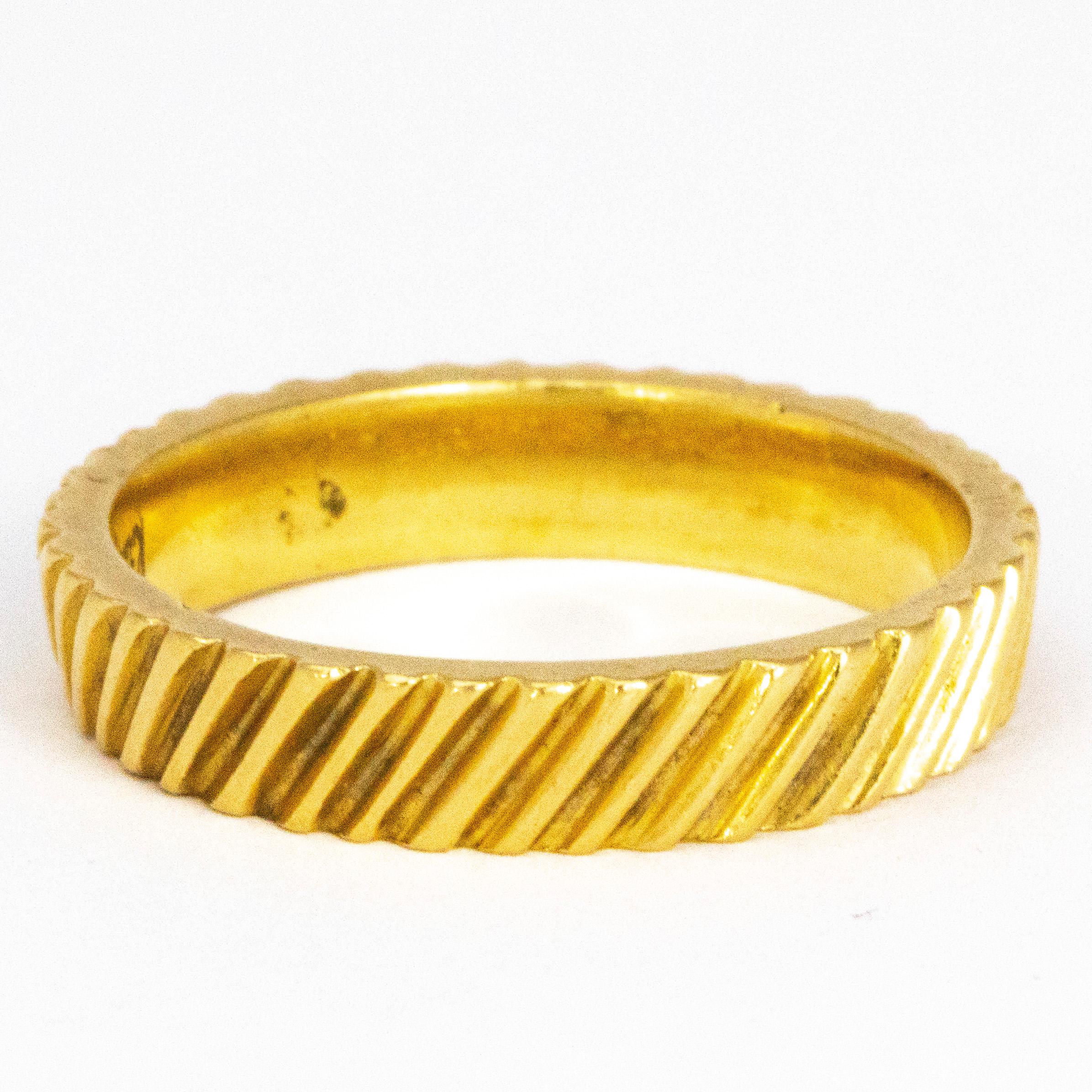 This gorgeous Kutchinsky ripple gold ring is modelled out of 18 Carat Gold. The grooves in this band are quite deep and prominent which give the ring a very modern look. 

Ring Size: O 1/2 or 7 1/2
Band Width: 4mm