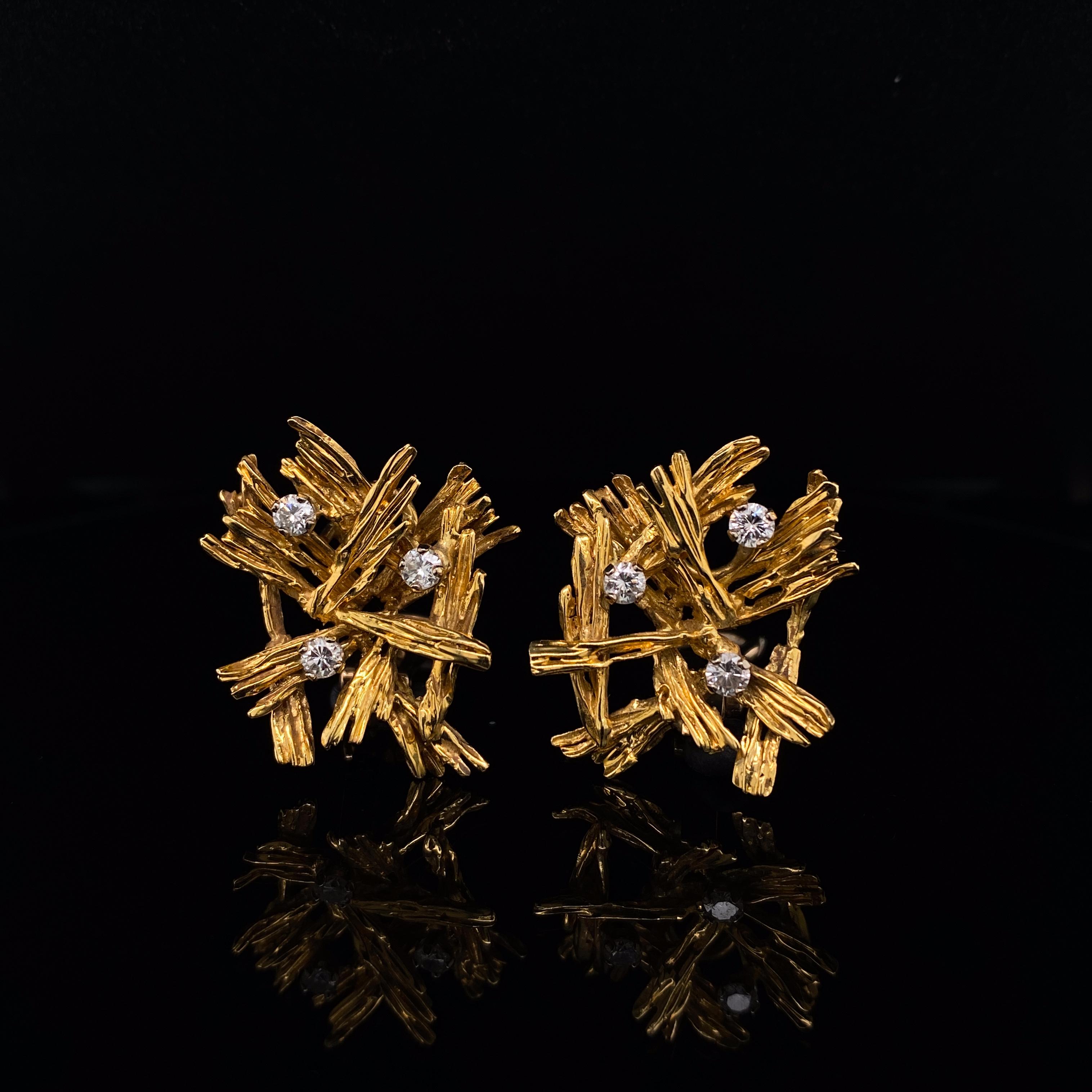 A fantastic statement pair of Kutchinsky 18 Karat Yellow Gold Diamond Clip Earrings circa 1970

Each earring is designed as an abstract spray, mounted in 18 karat textured yellow gold, highlighted by round brilliant-cut diamonds of approx. 0.50cts