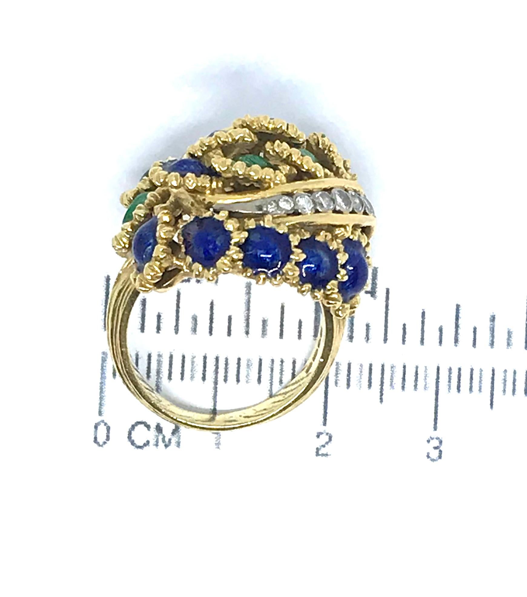 An enamel and diamond dress ring, dated 1969.  Of foliate bombe design, with blue and green enamel buds, highlighted by curved rows of brilliant-cut diamonds, signed Kutchinsky, maker's mark, London hallmark, ring size N.  