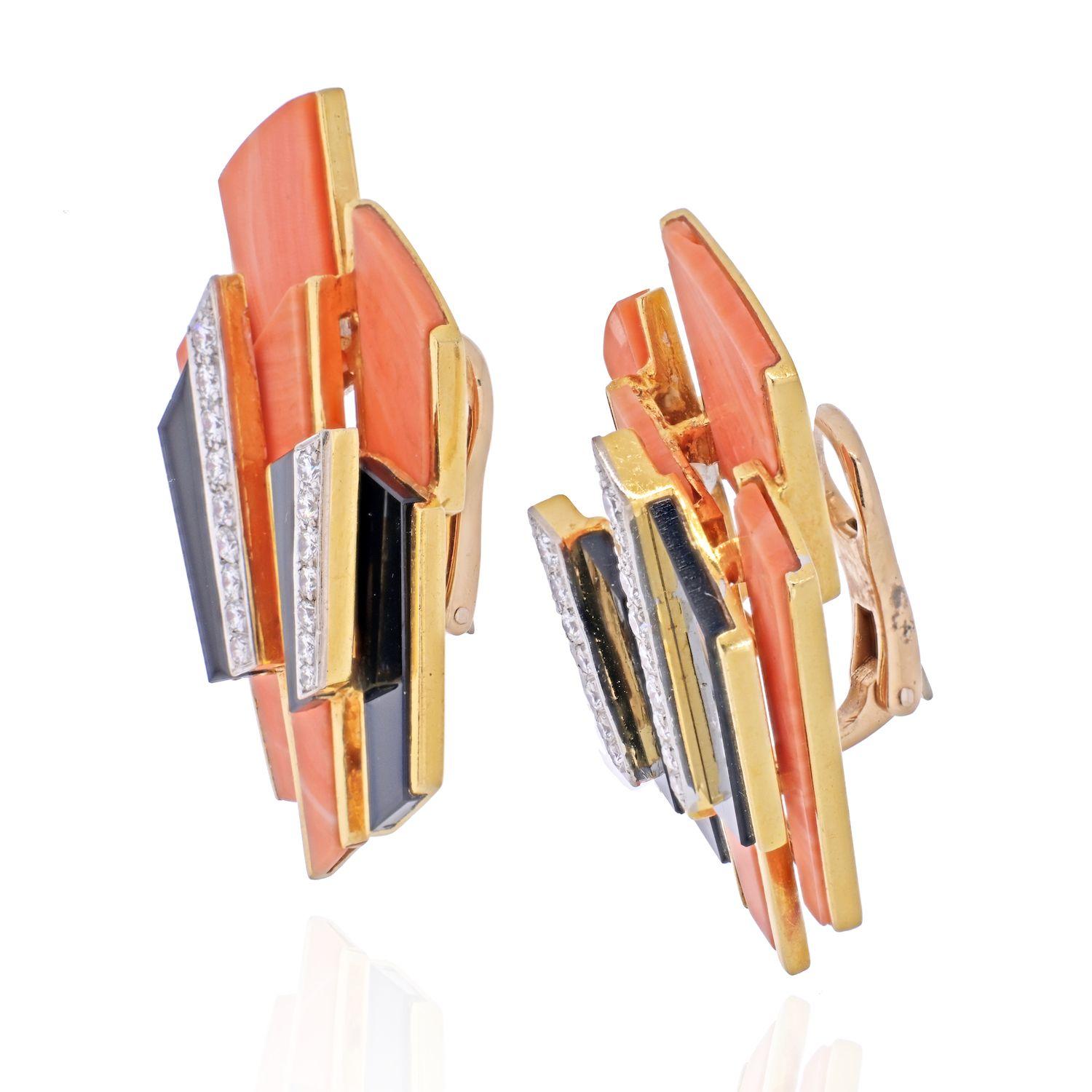 Kutchinsky Vintage 1.30ctw VS1-VS2/G-H Diamond, Coral & Onyx Solid 18K Yellow Gold Ear Clips.

House of Kutchinsky earrings were finely crafted of solid 18k yellow gold. 

The earrings are decorated with inset genuine coral and onyx, and are